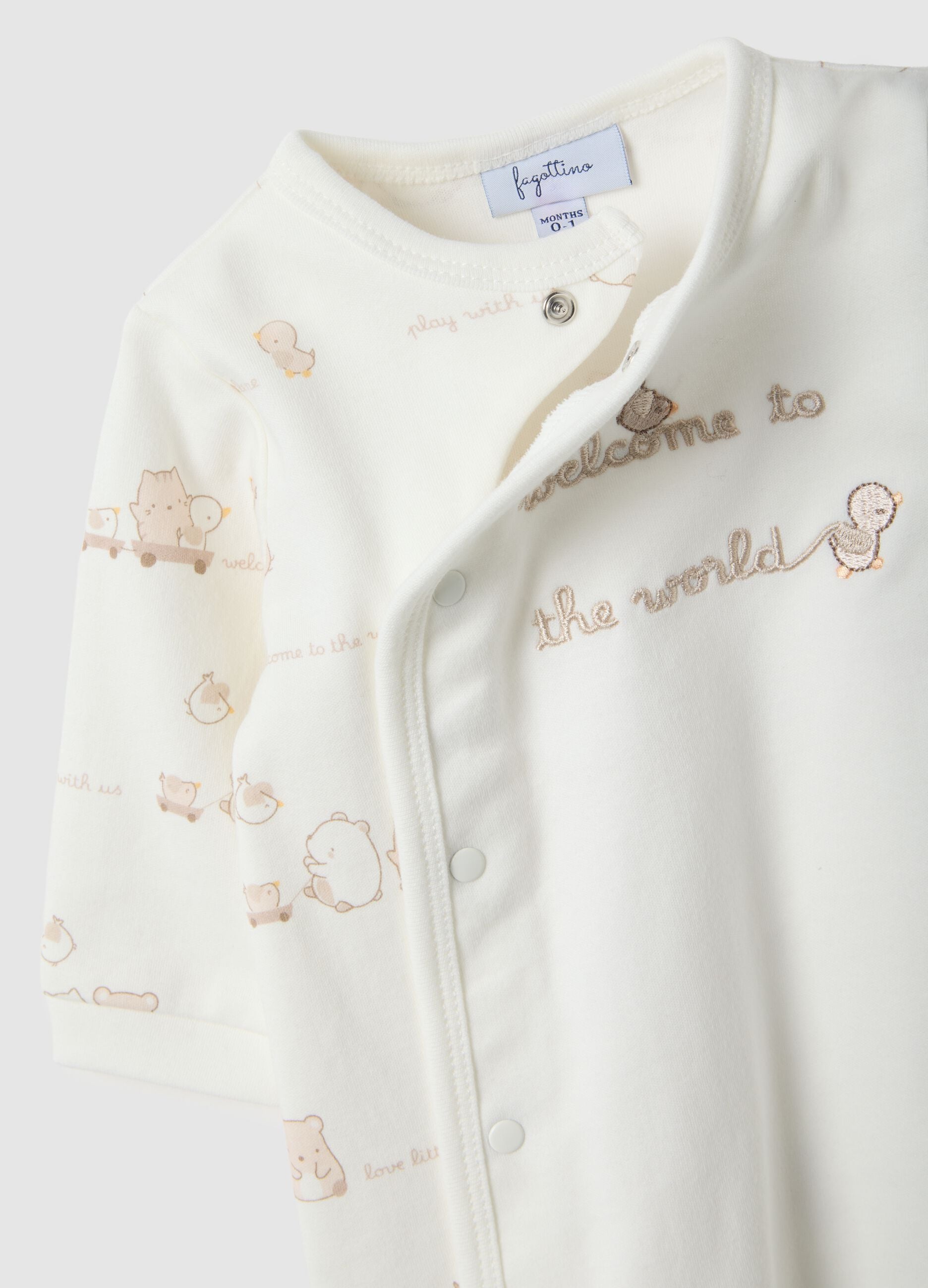 White newborn romper in pure cotton with long sleeves and embroidery