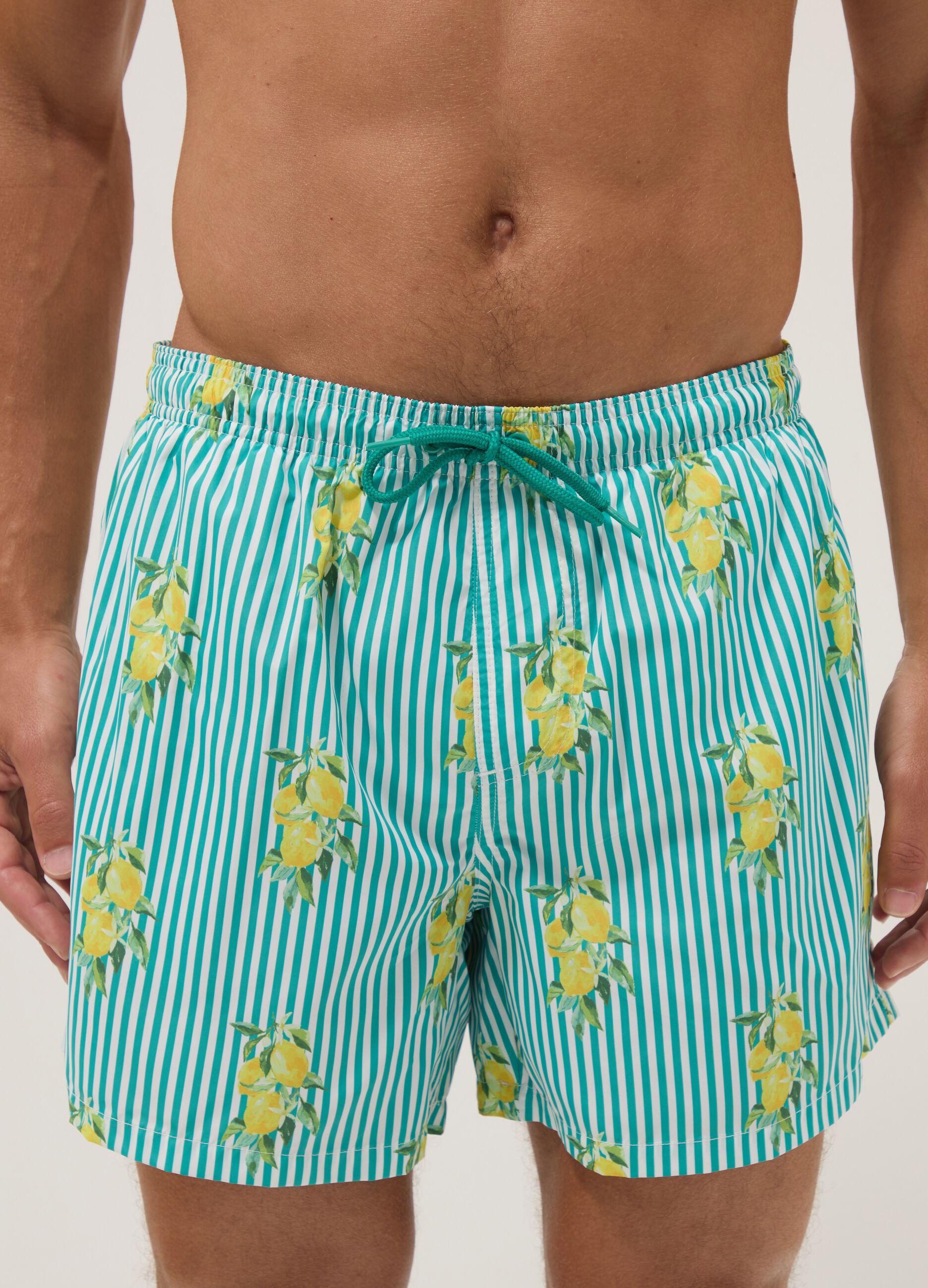 Blue striped swim shorts with lemon print