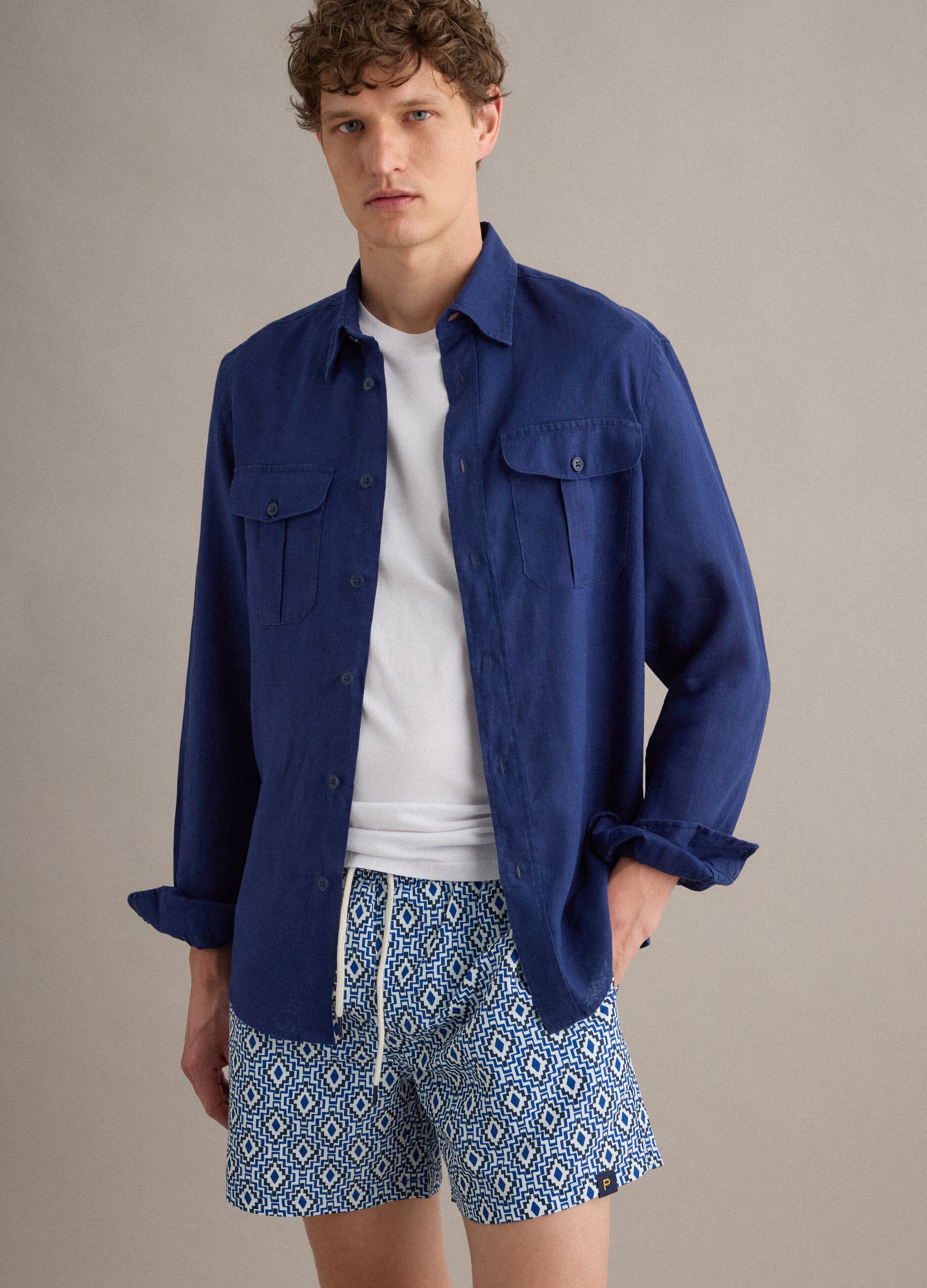 Blue swim shorts with geometric print