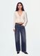 White stretch top with deep V-neck and ruffle trim_0