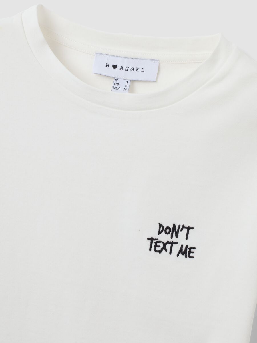 T-shirt crop bianca in puro cotone con stampa grafica regular fit_2