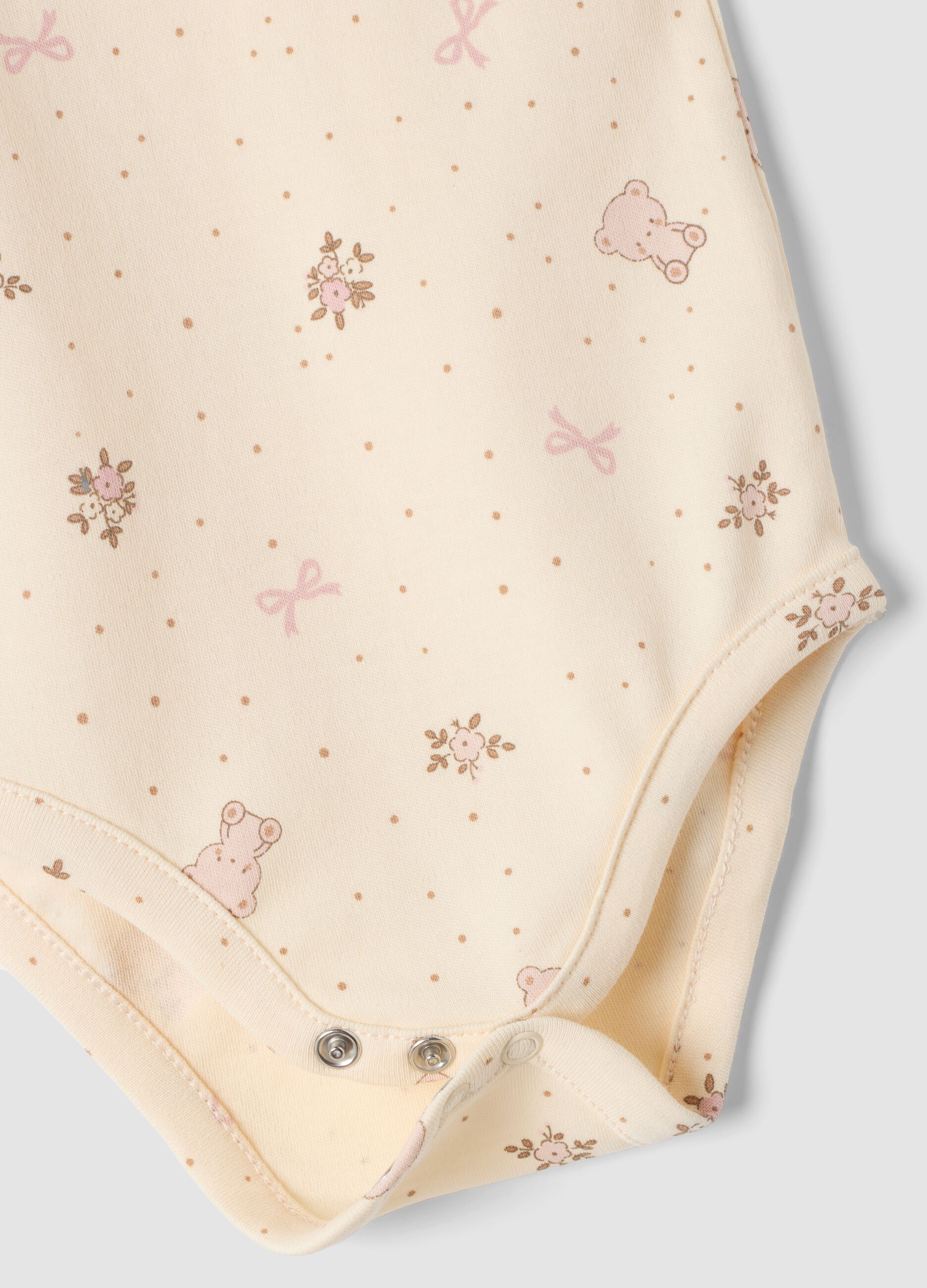 3-pack pink and beige organic cotton bodysuits with print