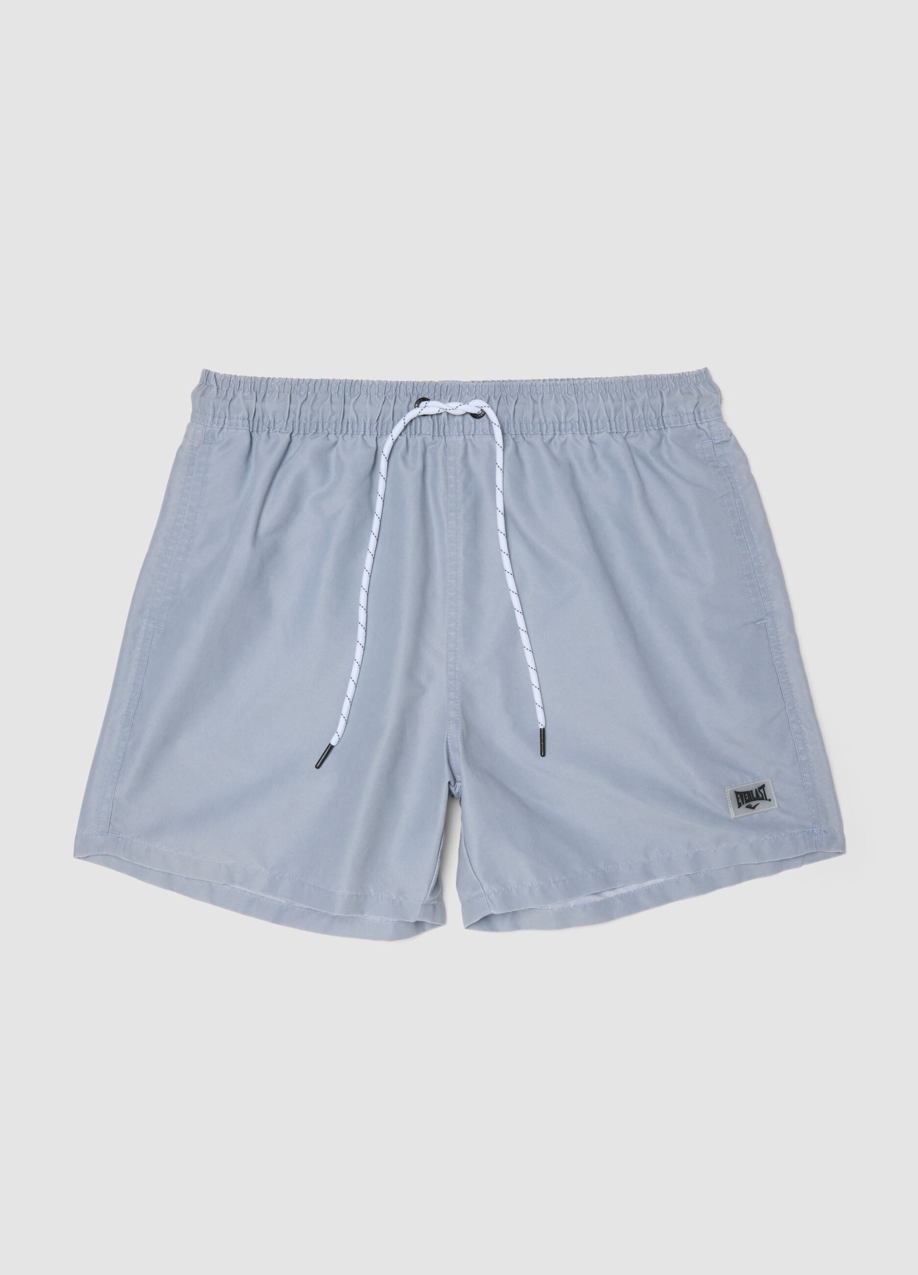 Blue swim shorts with drawstring waist