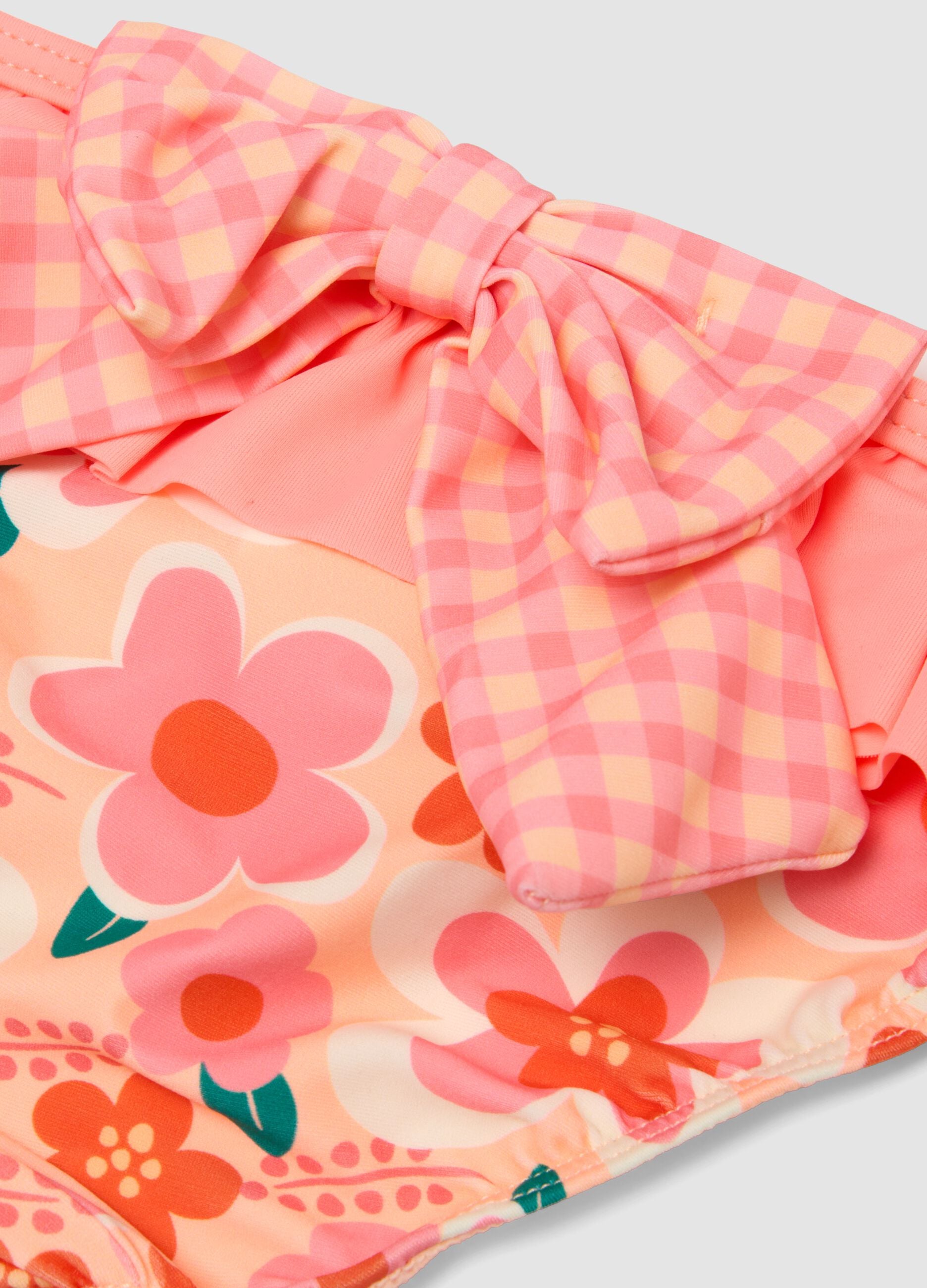 Pink stretchy fabric swim briefs with ruffles for baby girls
