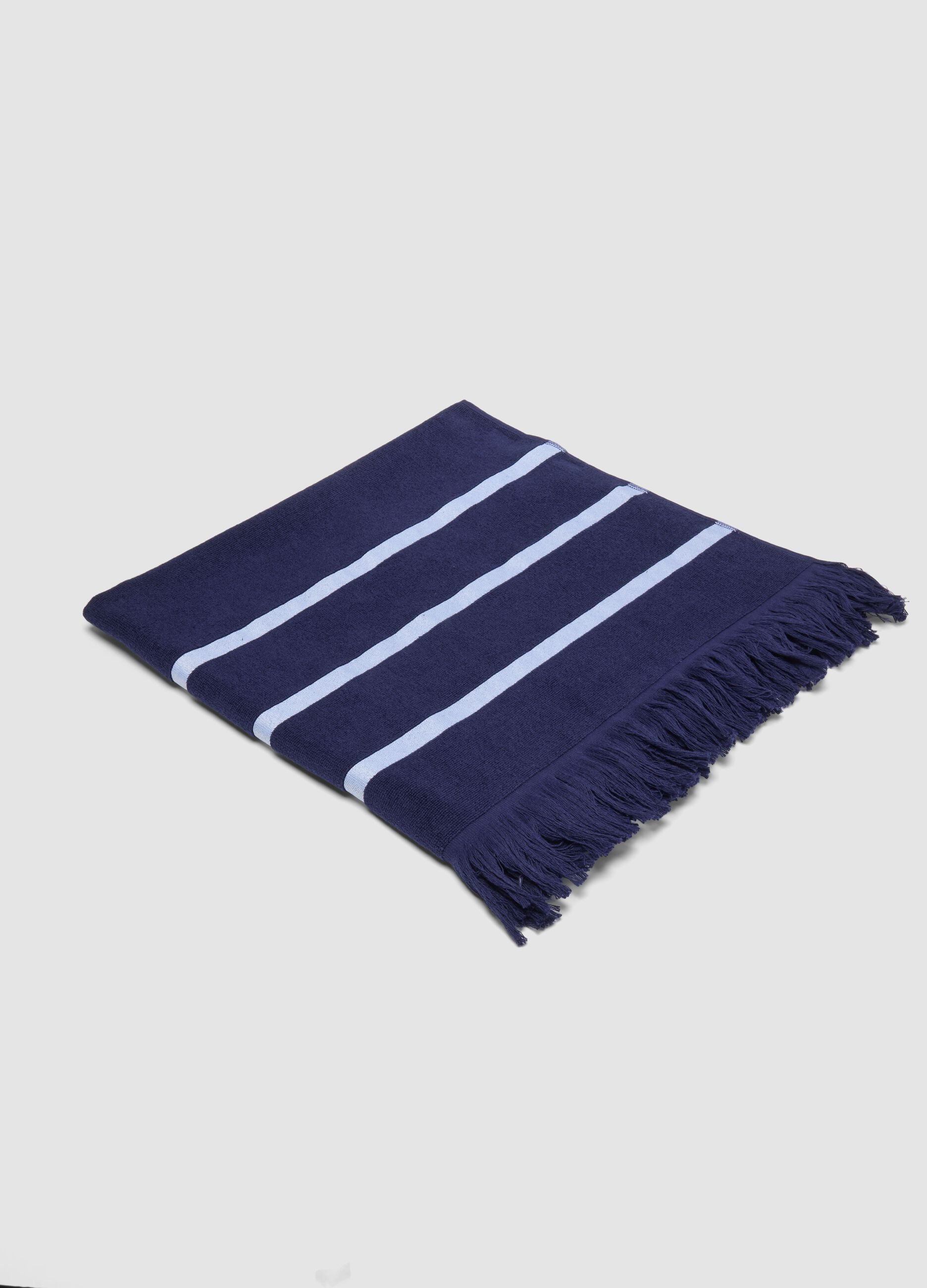 Blue cotton-blend beach towel with fringes