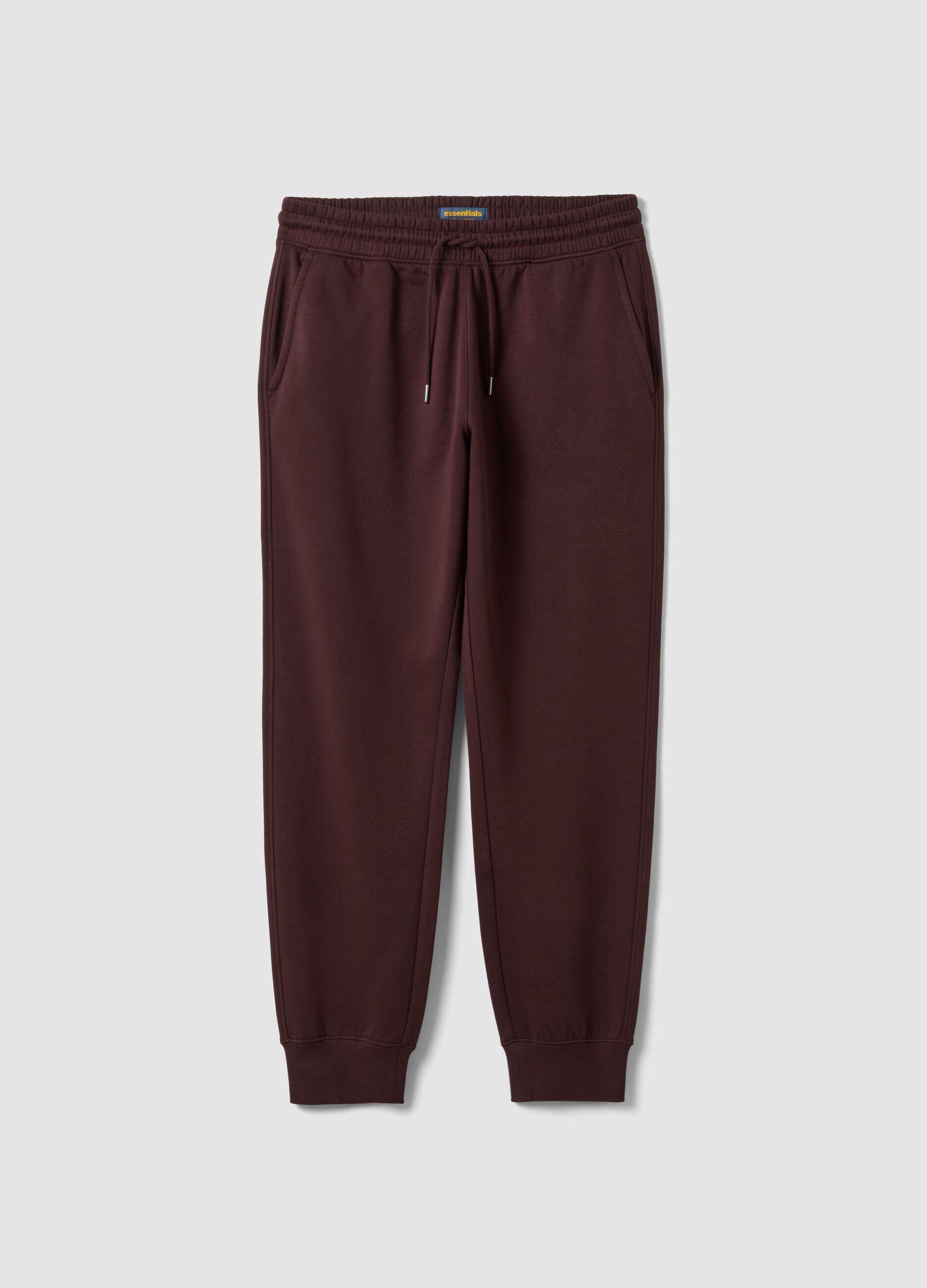 Brown cotton-blend joggers with cuffed hems and drawstring