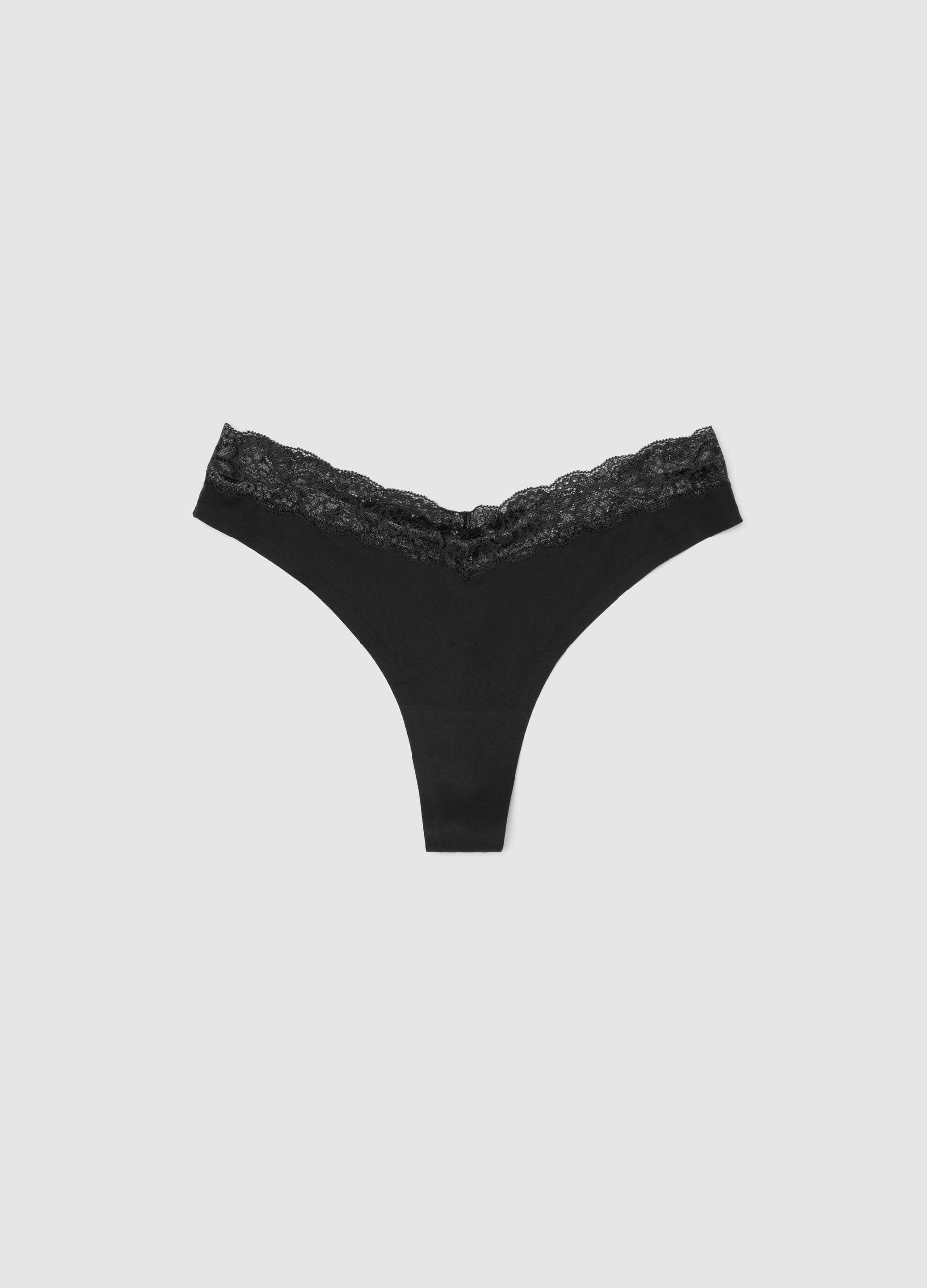 Black thong in stretch fabric with lace details
