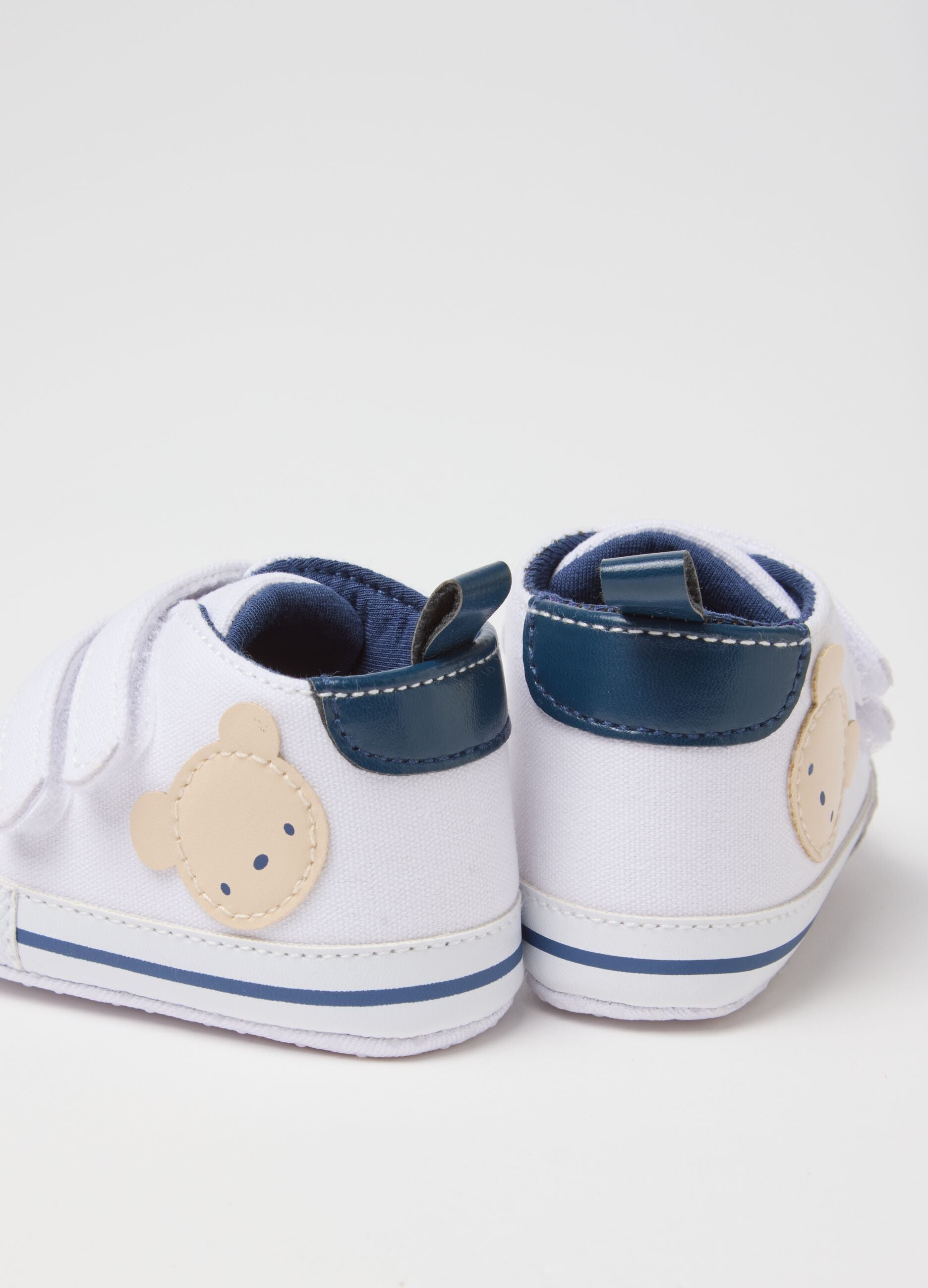 White canvas baby shoes
