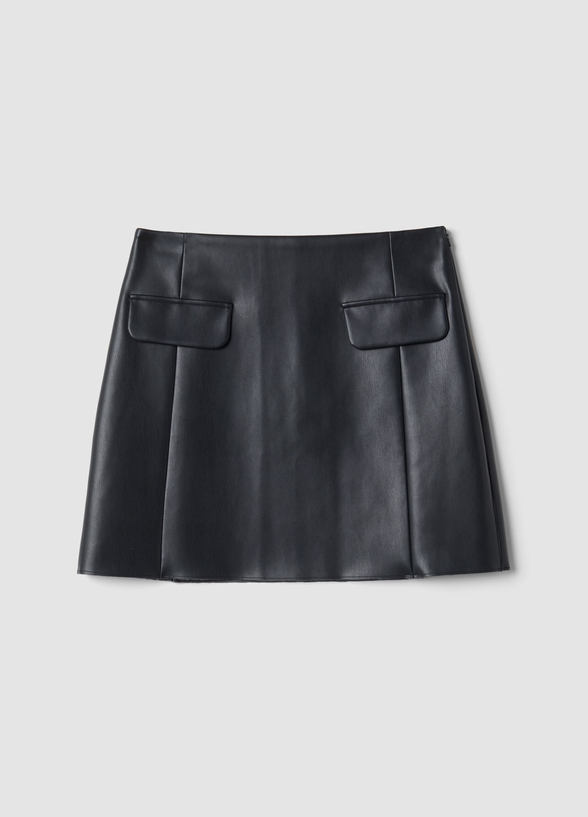 Short black A-line skirt with decorative flap pockets