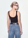 Black stretch cotton top with asymmetric hem and metal eyelets_2