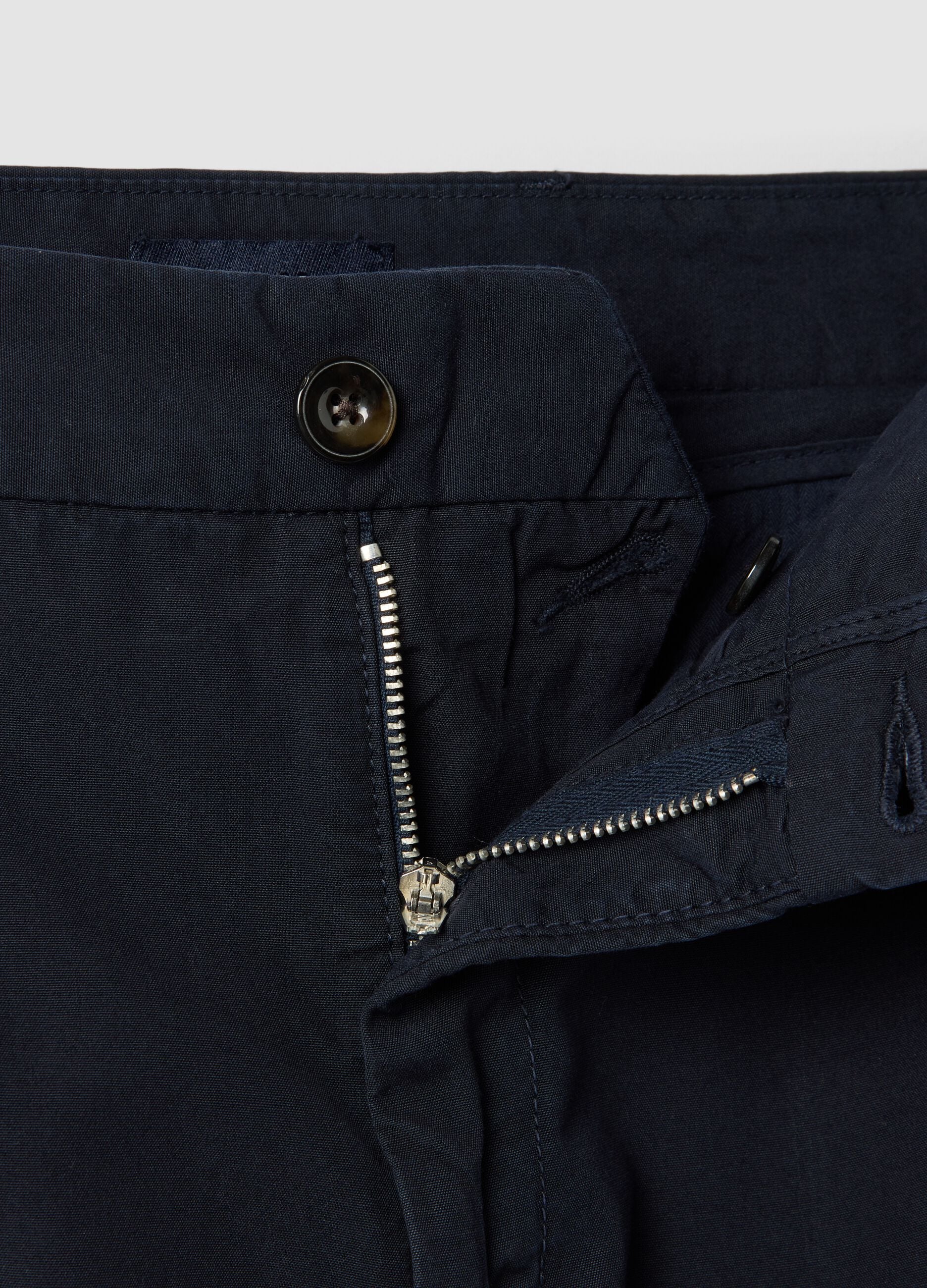 Blue cotton chino trousers with carrot fit