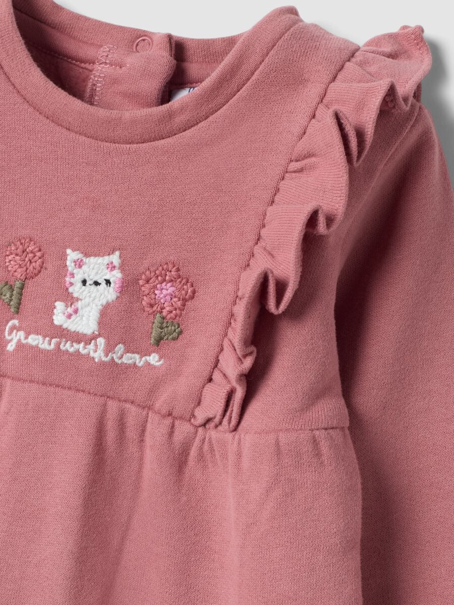 Pink organic cotton sleepsuit with ruffles and chest embroidery_2