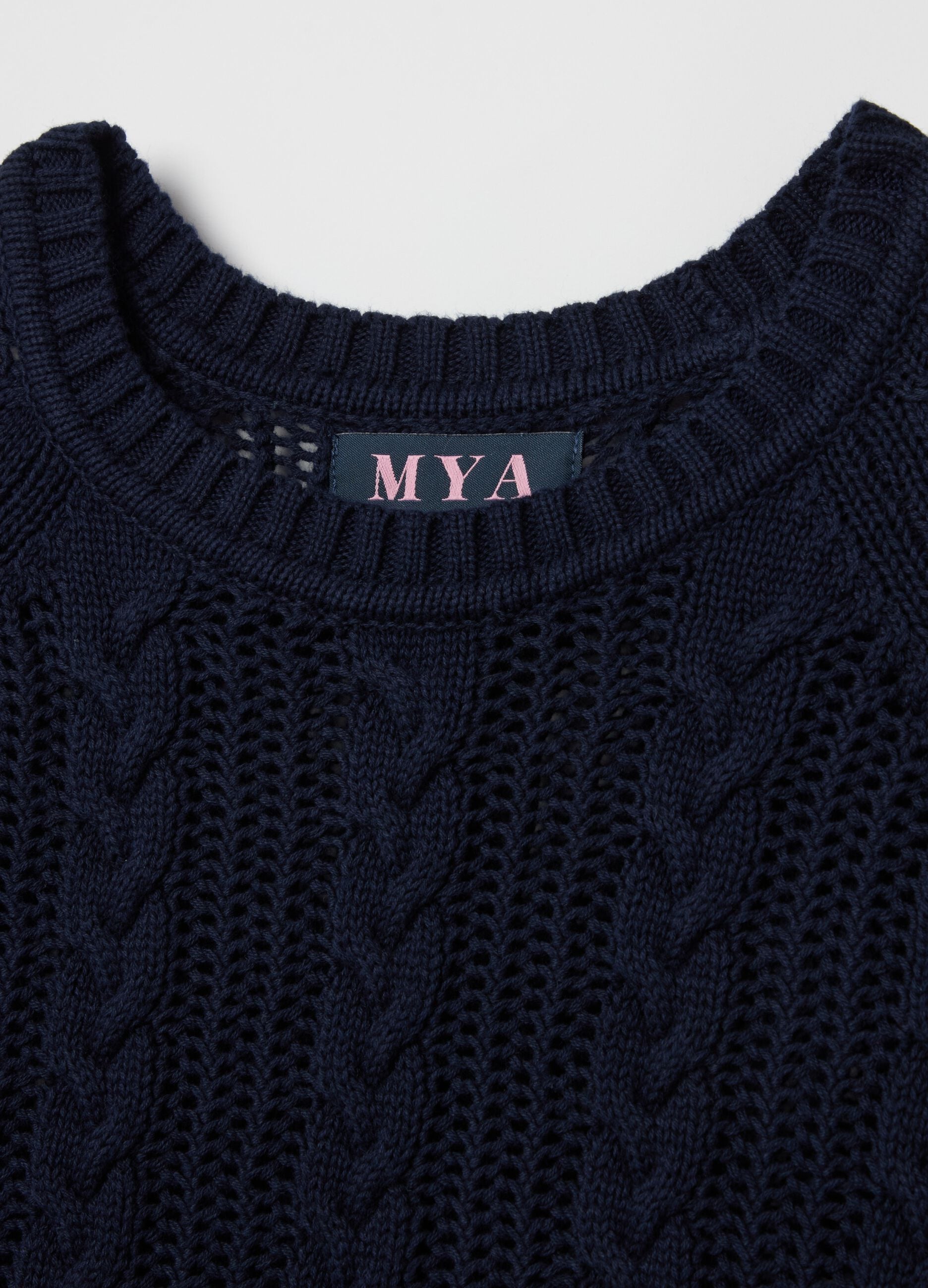 Curvy crochet pullover with cable-knit design