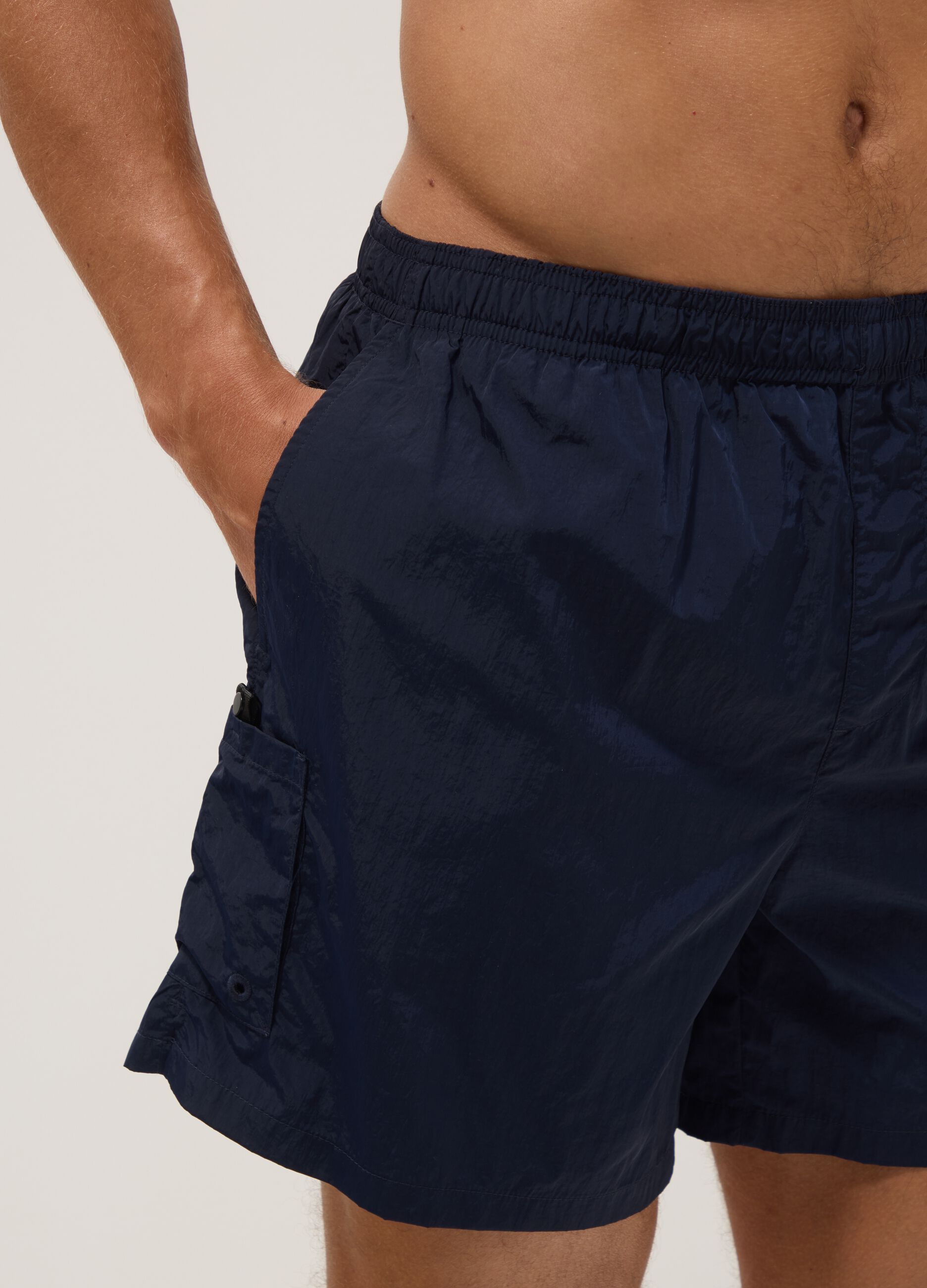 Blue swim shorts with elasticated waistband
