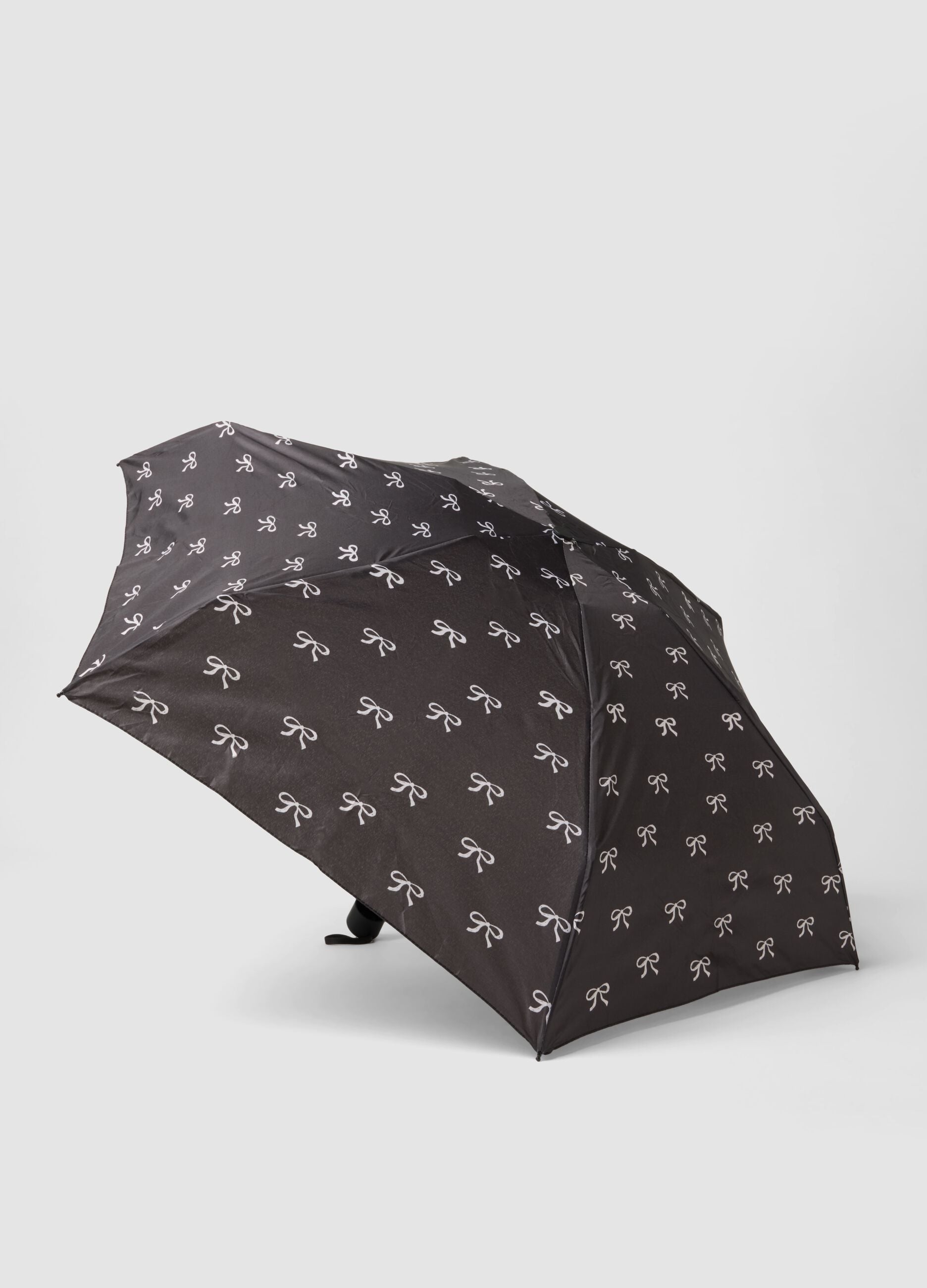 Black folding umbrella with bow print