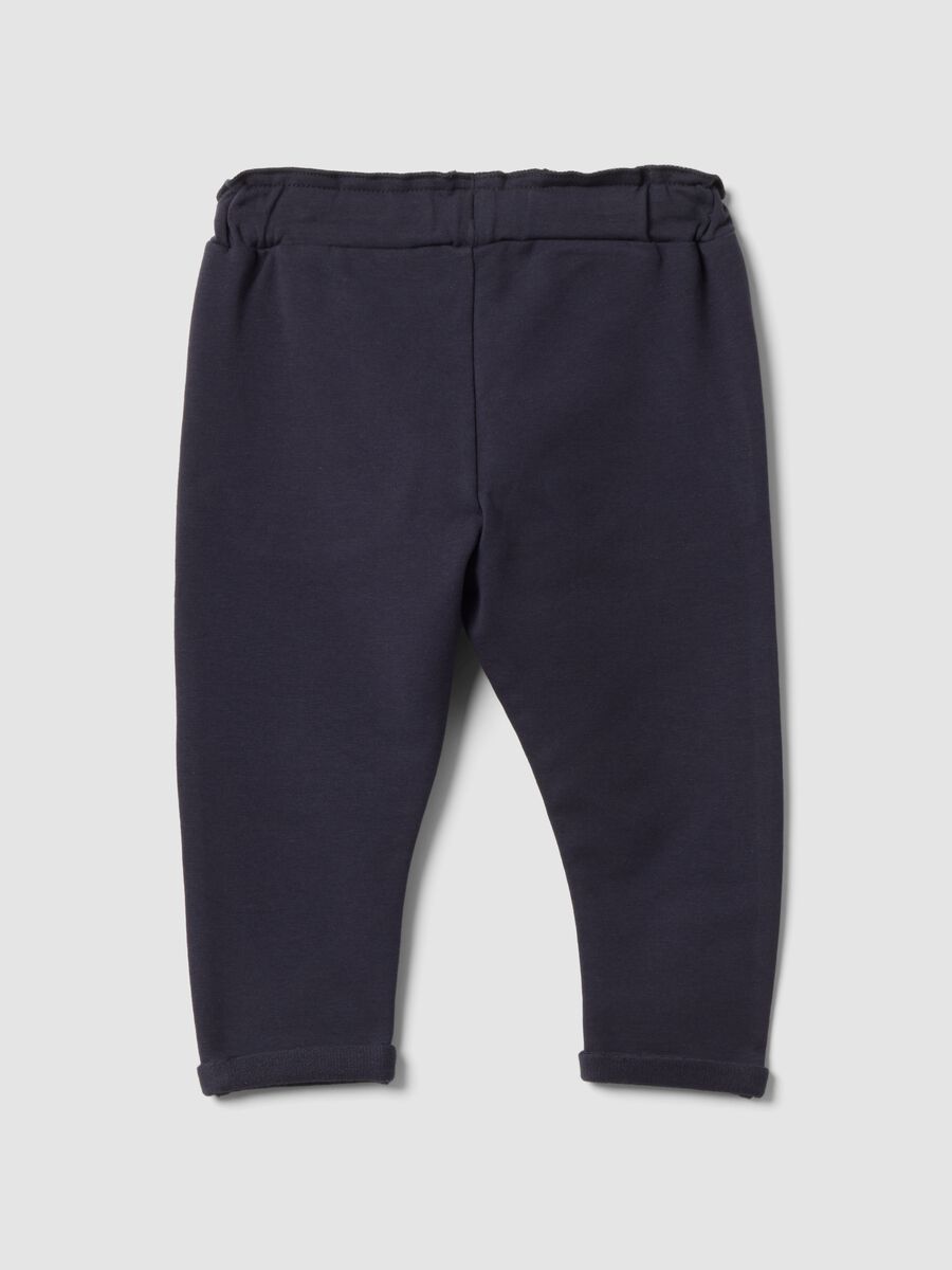 Grey stretch cotton joggers with turn-up cuffs for baby girl_1