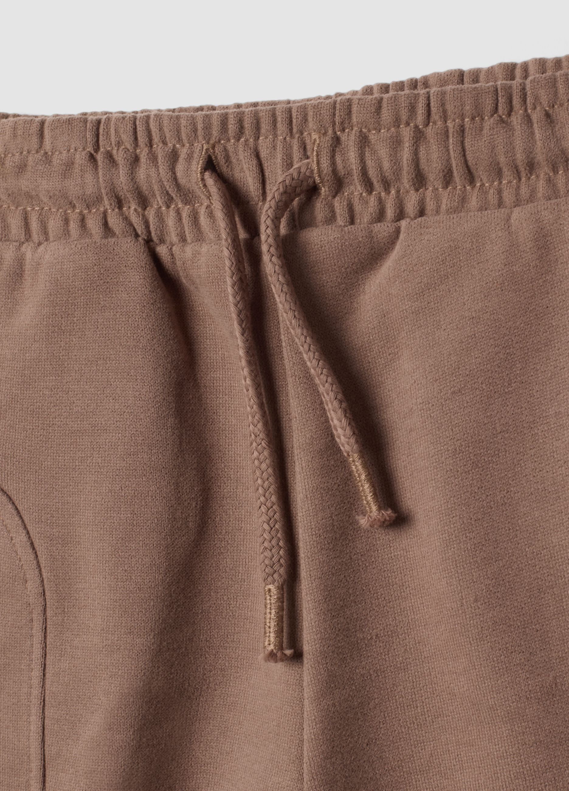 Brown organic cotton trousers with elasticated waist