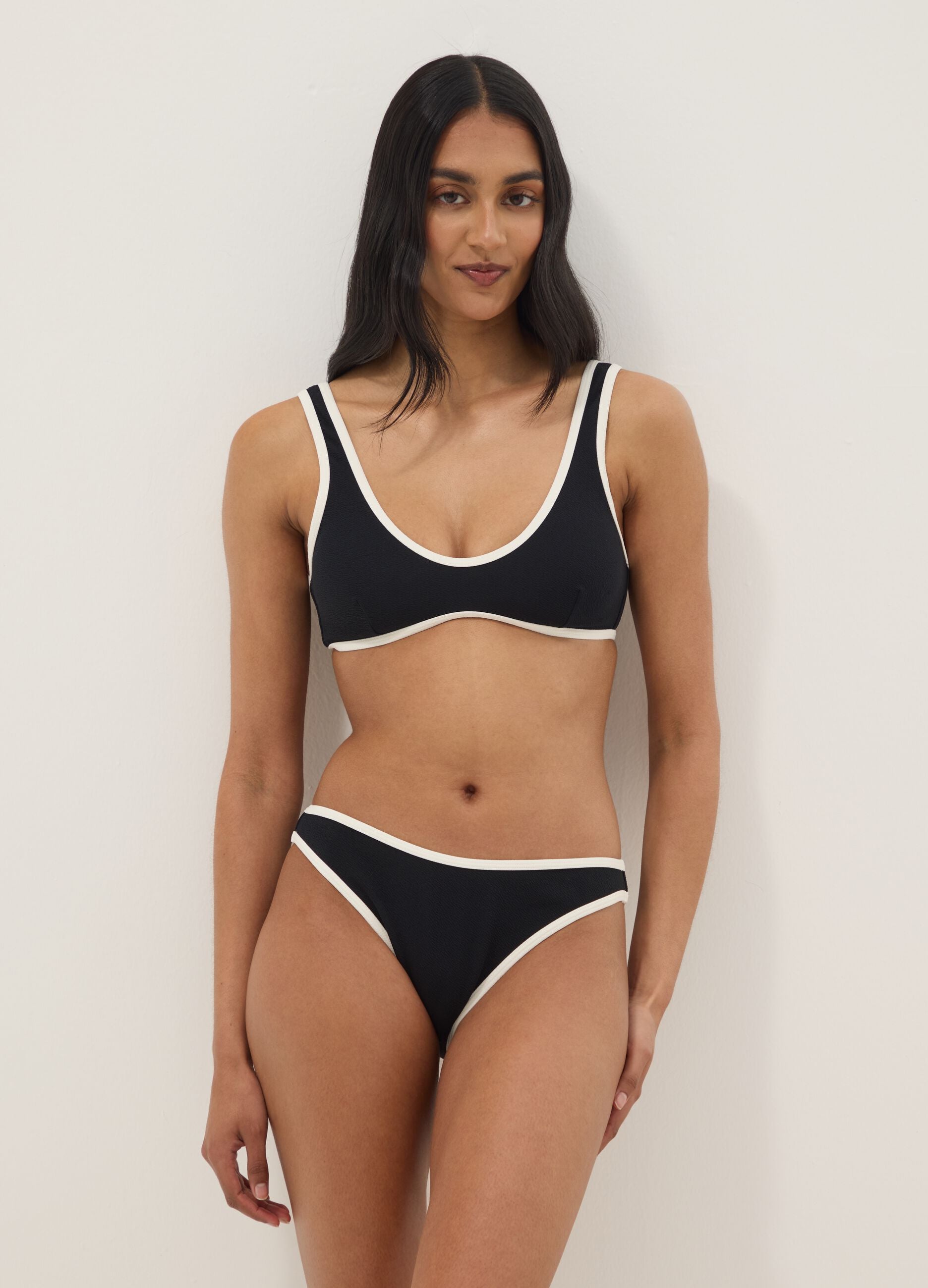 Black stretch swim briefs with white trim