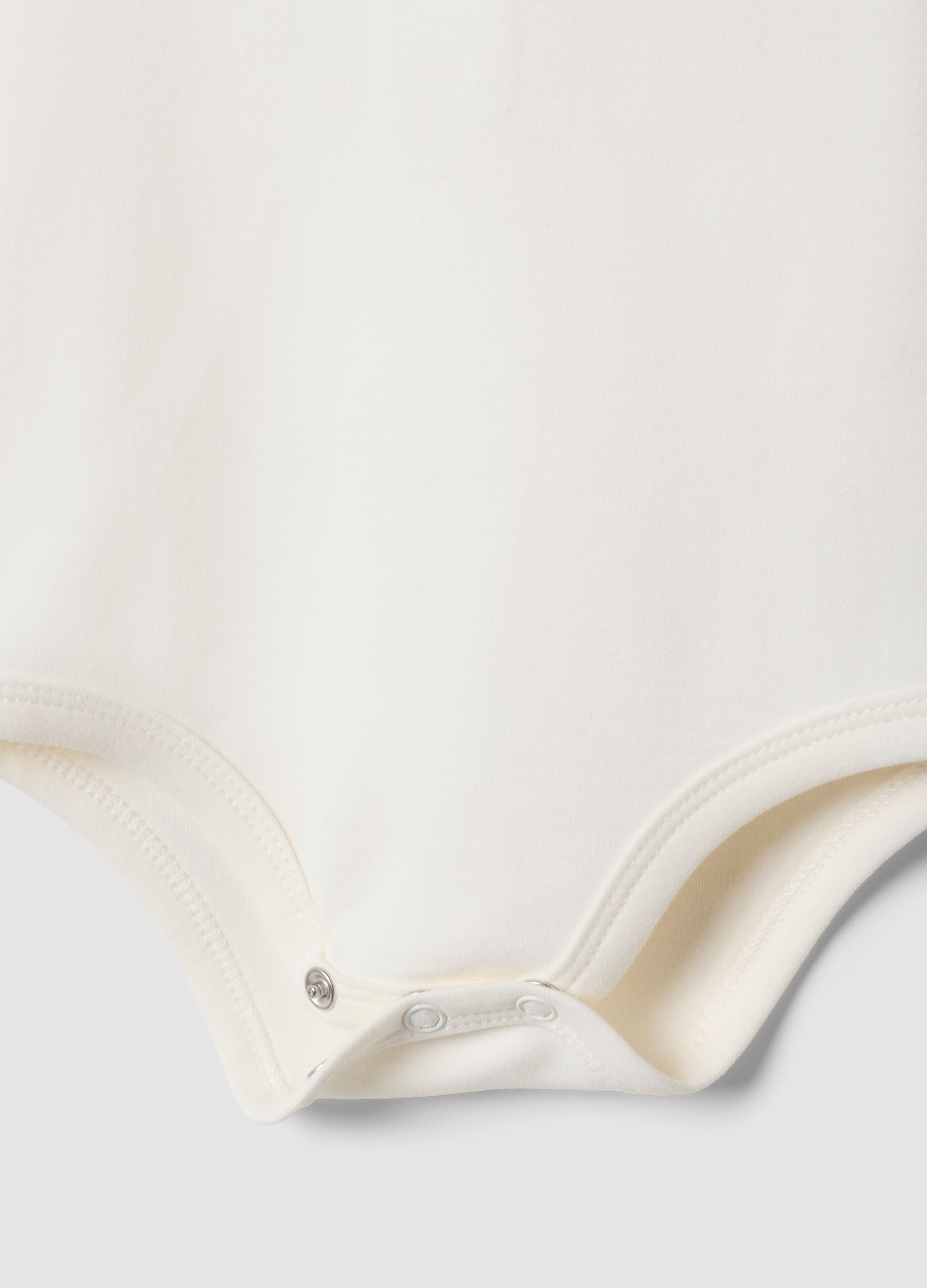 White organic cotton baby girl bodysuit with embroidered collar