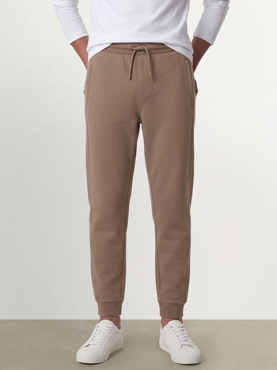 Pantaloni jogger beige in cotone organico_1
