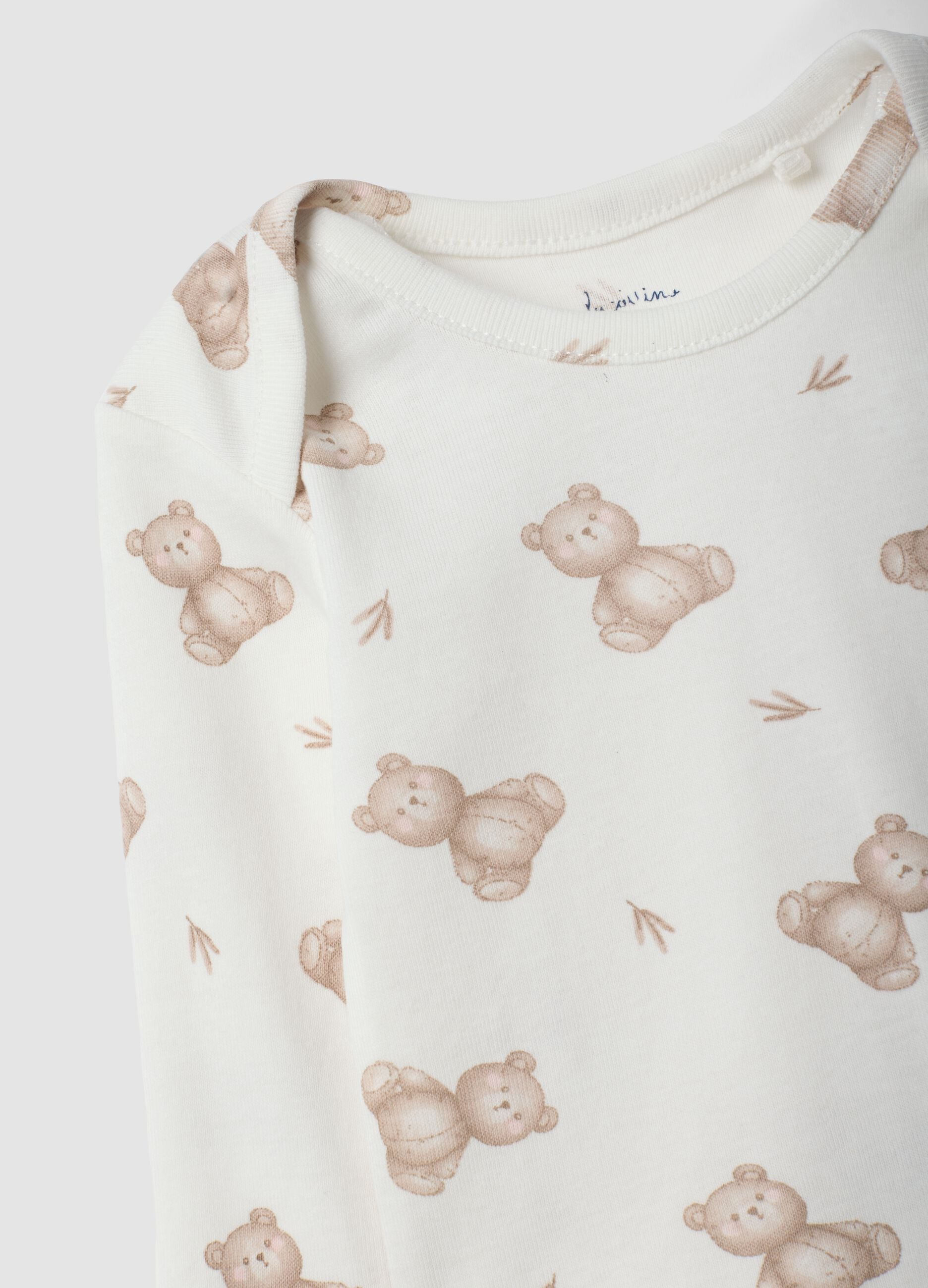 White organic cotton set with printed bodysuit and leggings for babies