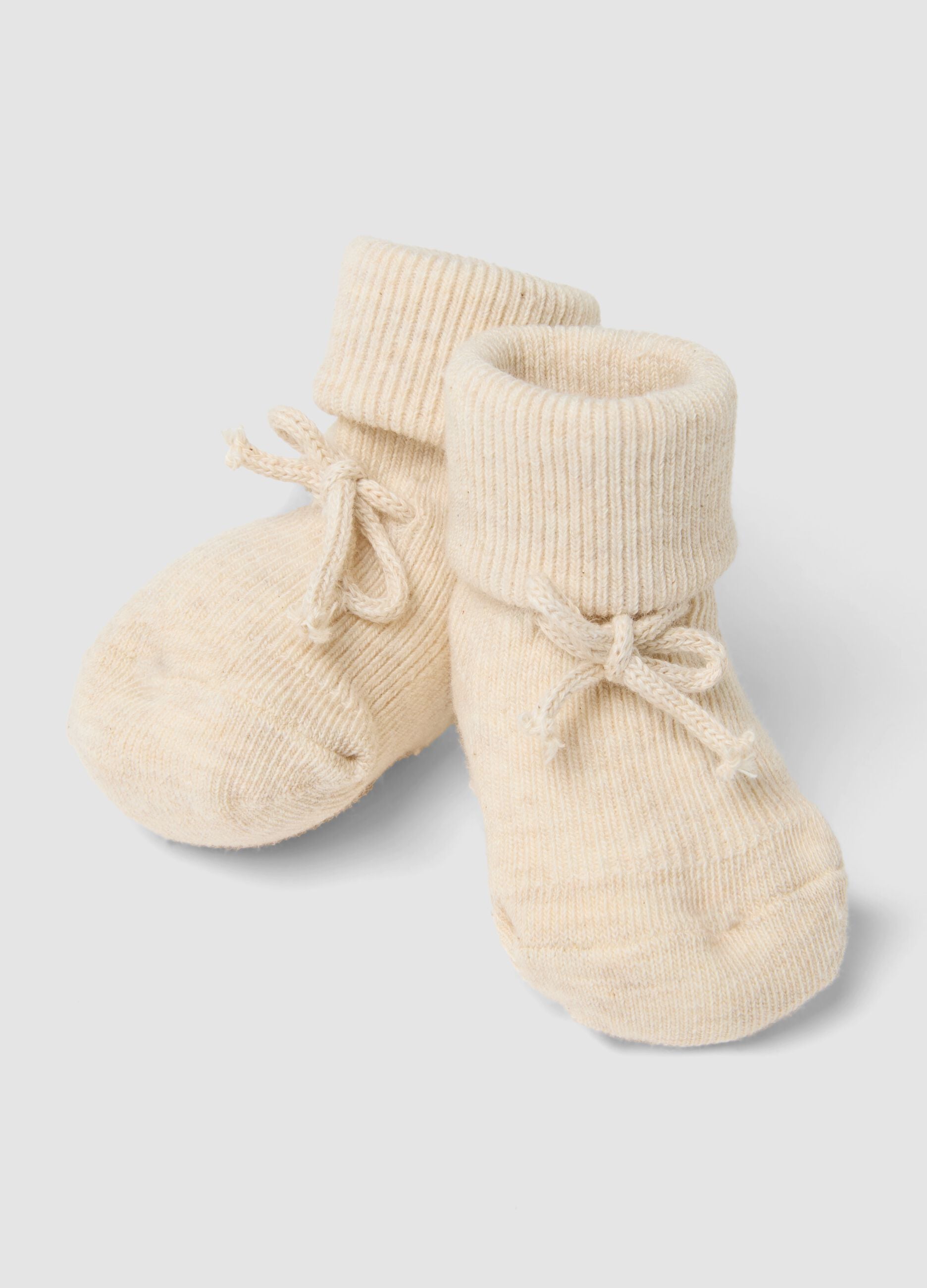 Beige organic cotton knitted baby girl booties