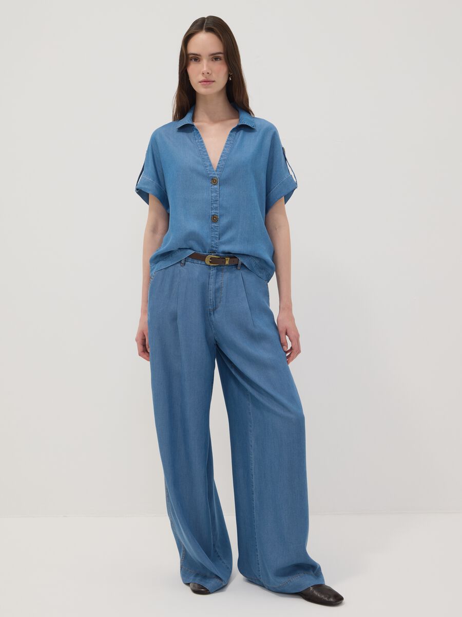 Light blue wide-leg denim trousers in pure lyocell_0
