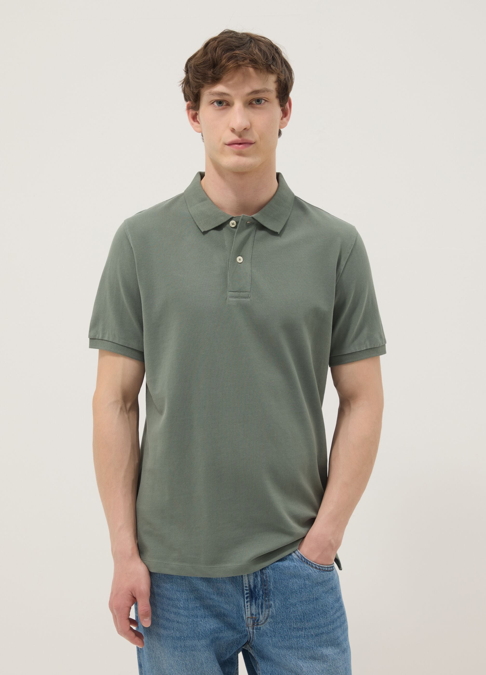 Green short-sleeved polo shirt in pure organic cotton