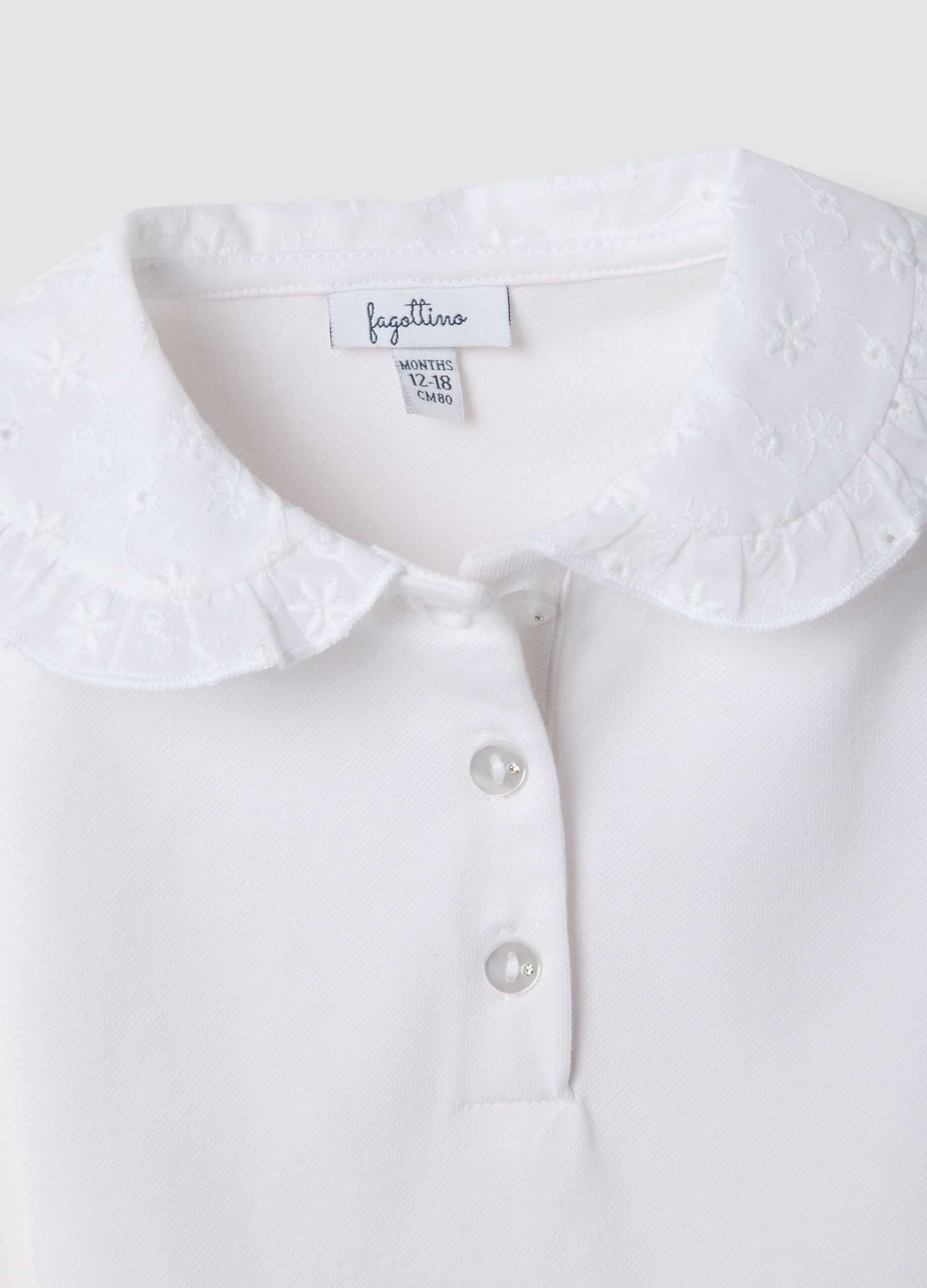 White short-sleeve stretch-cotton polo with ruffled collar