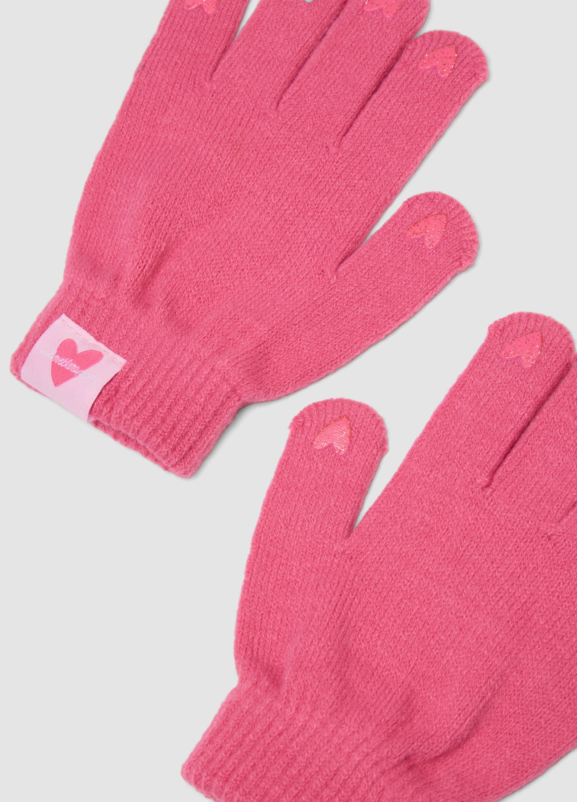Pink knitted gloves with hearts