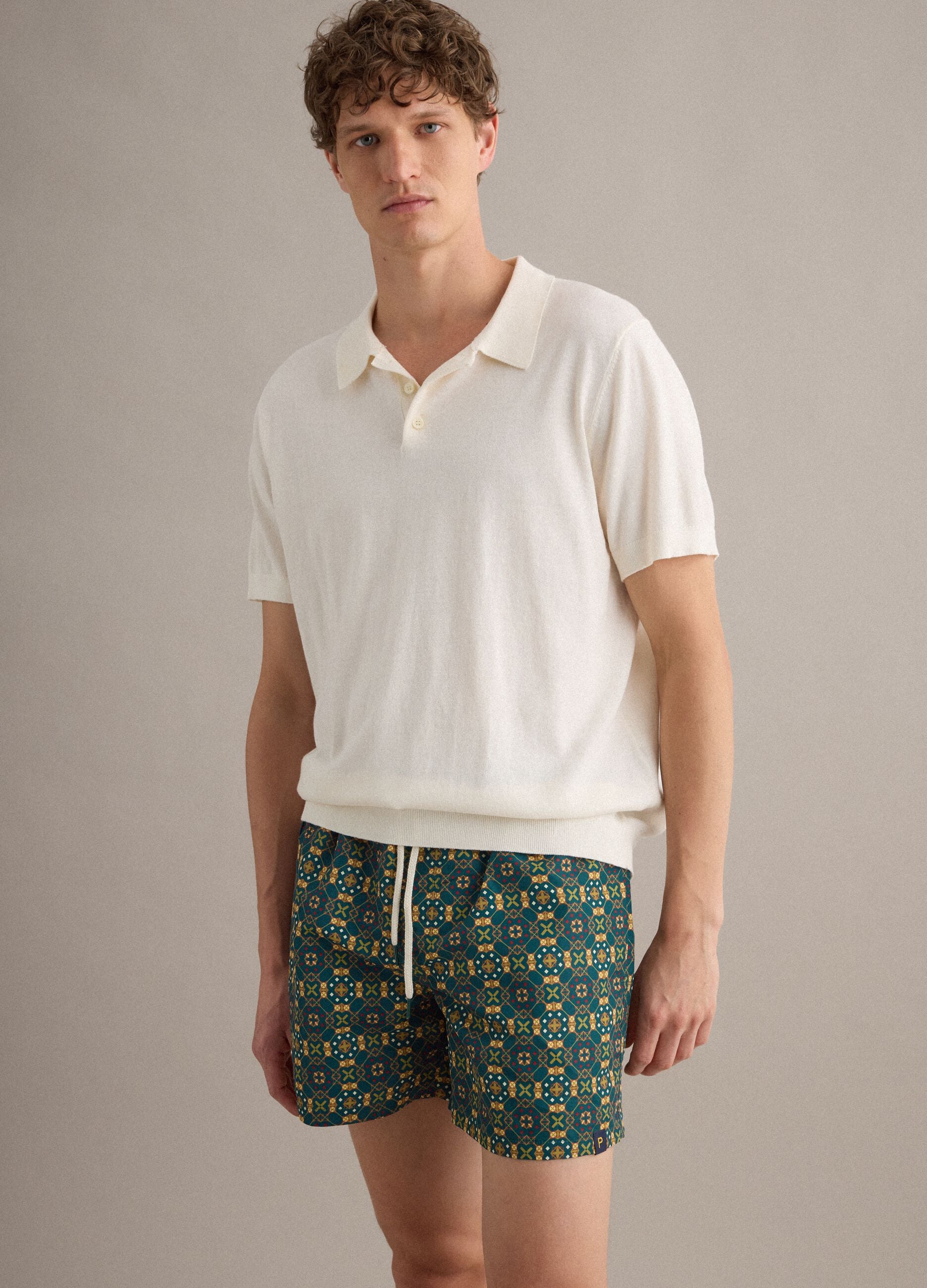 Green patterned swim shorts with elasticated waist