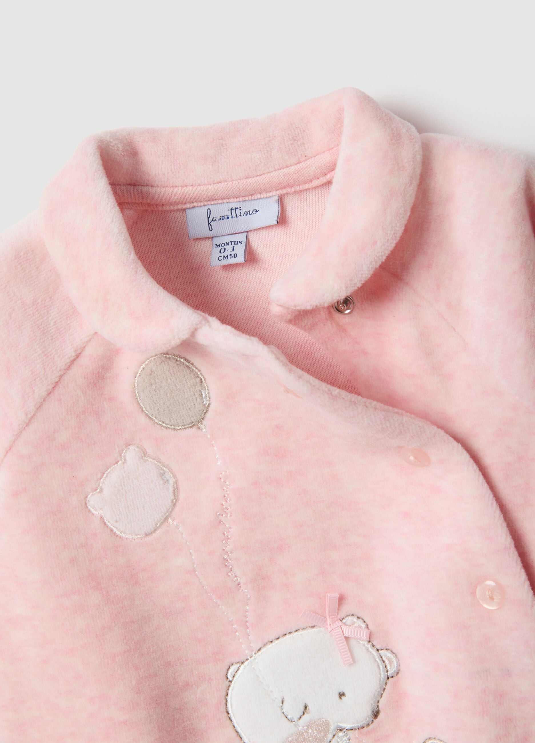 Pink newborn romper in cotton blend with snap closure and embroidery