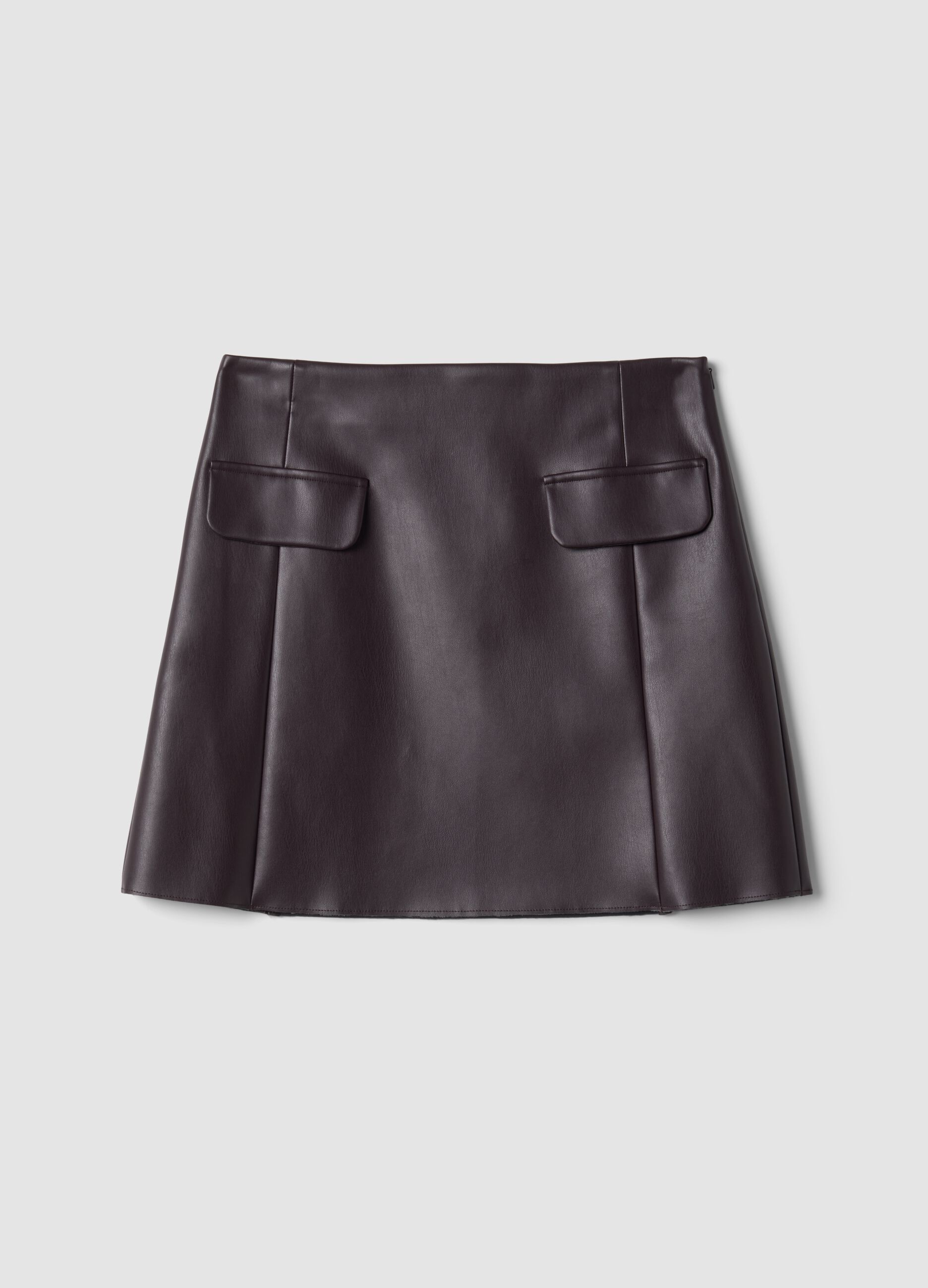 Short purple A-line skirt with decorative flap details