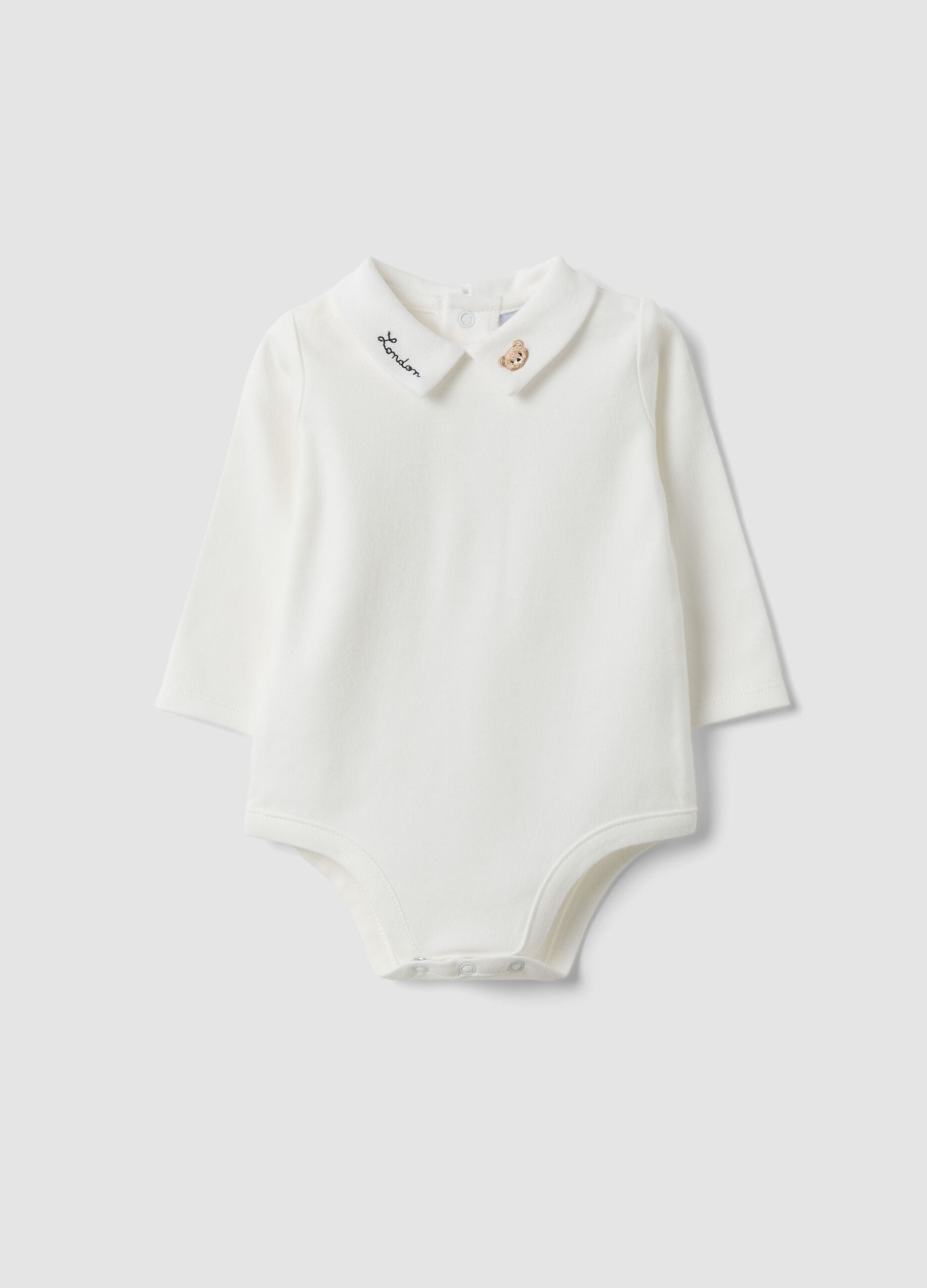 White organic cotton baby bodysuit with collar