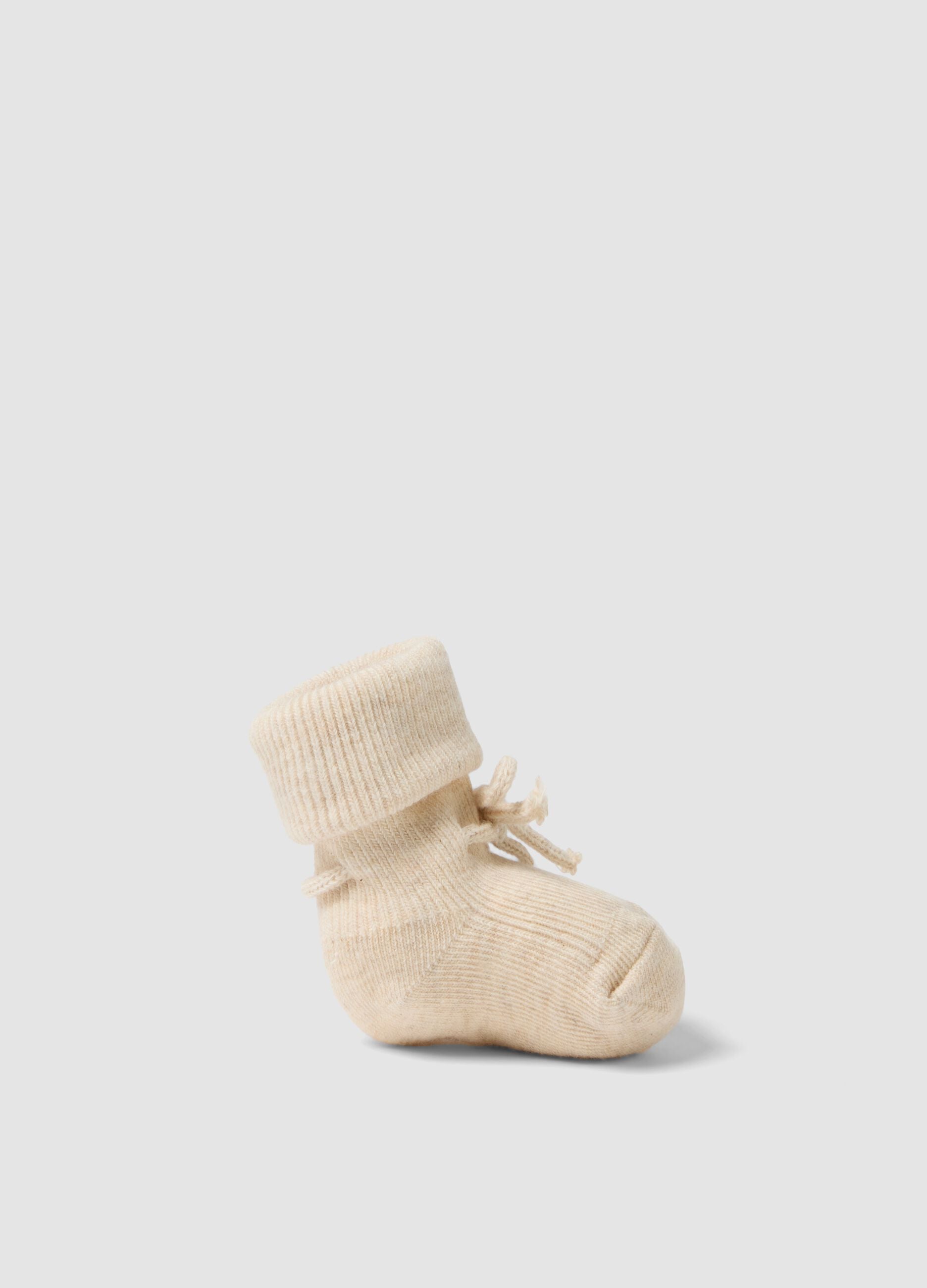 Beige organic cotton knitted baby girl booties