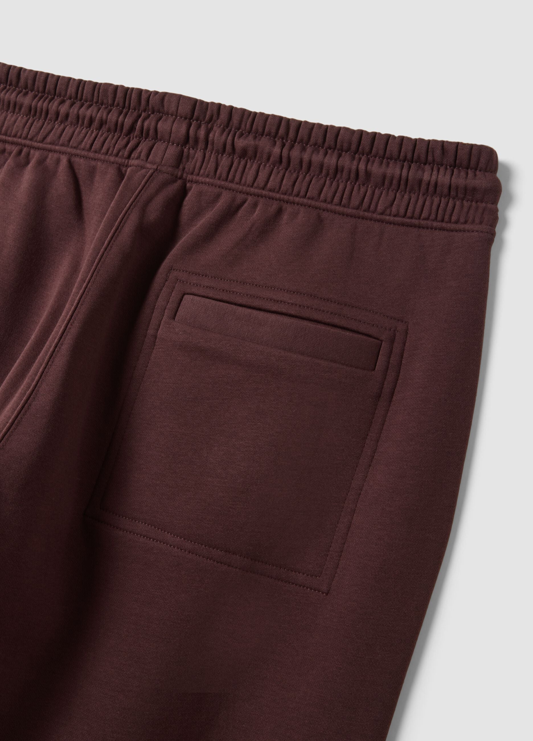 Brown cotton-blend joggers with cuffed hems and drawstring