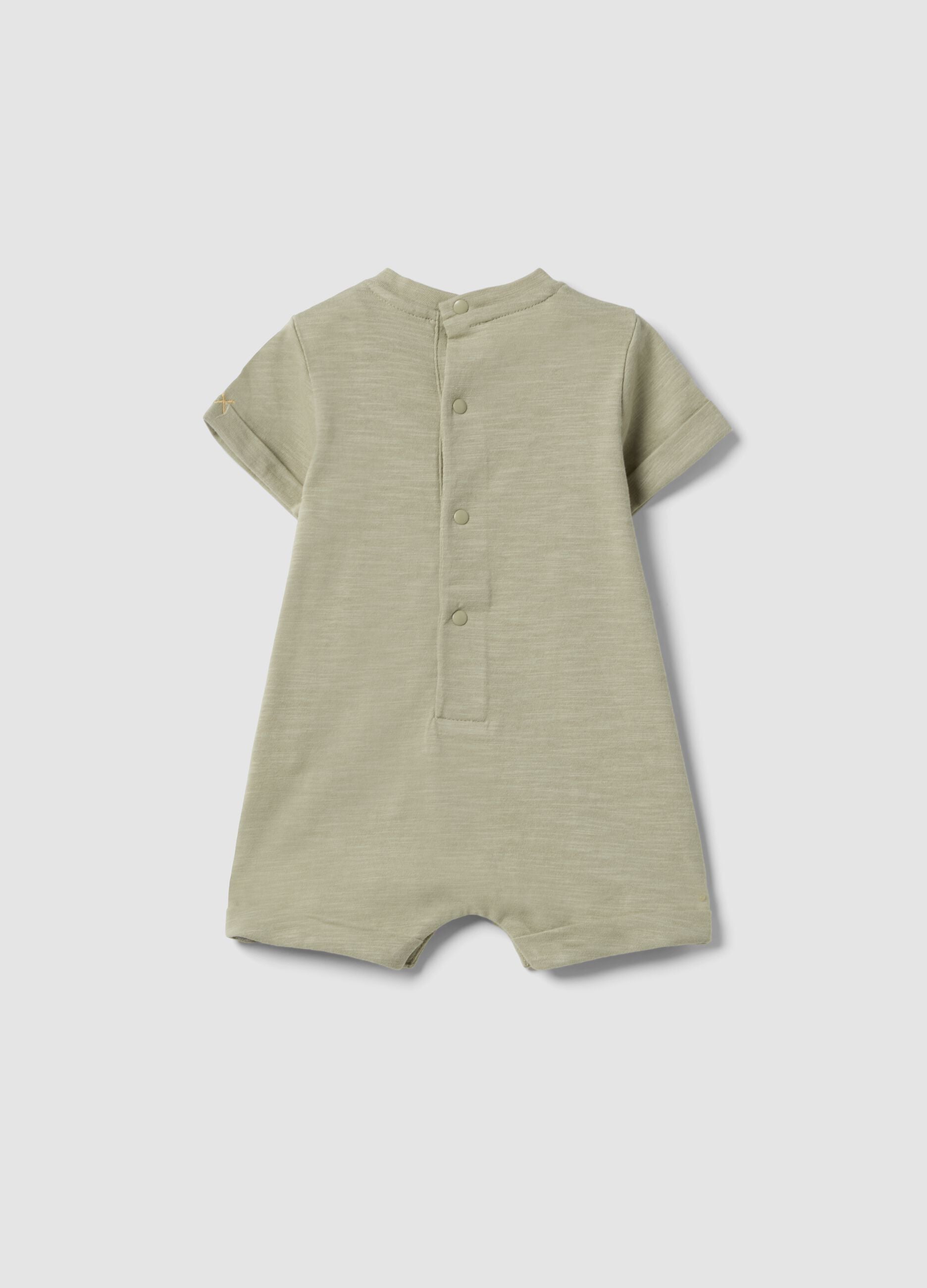 Green organic cotton baby romper with animal print
