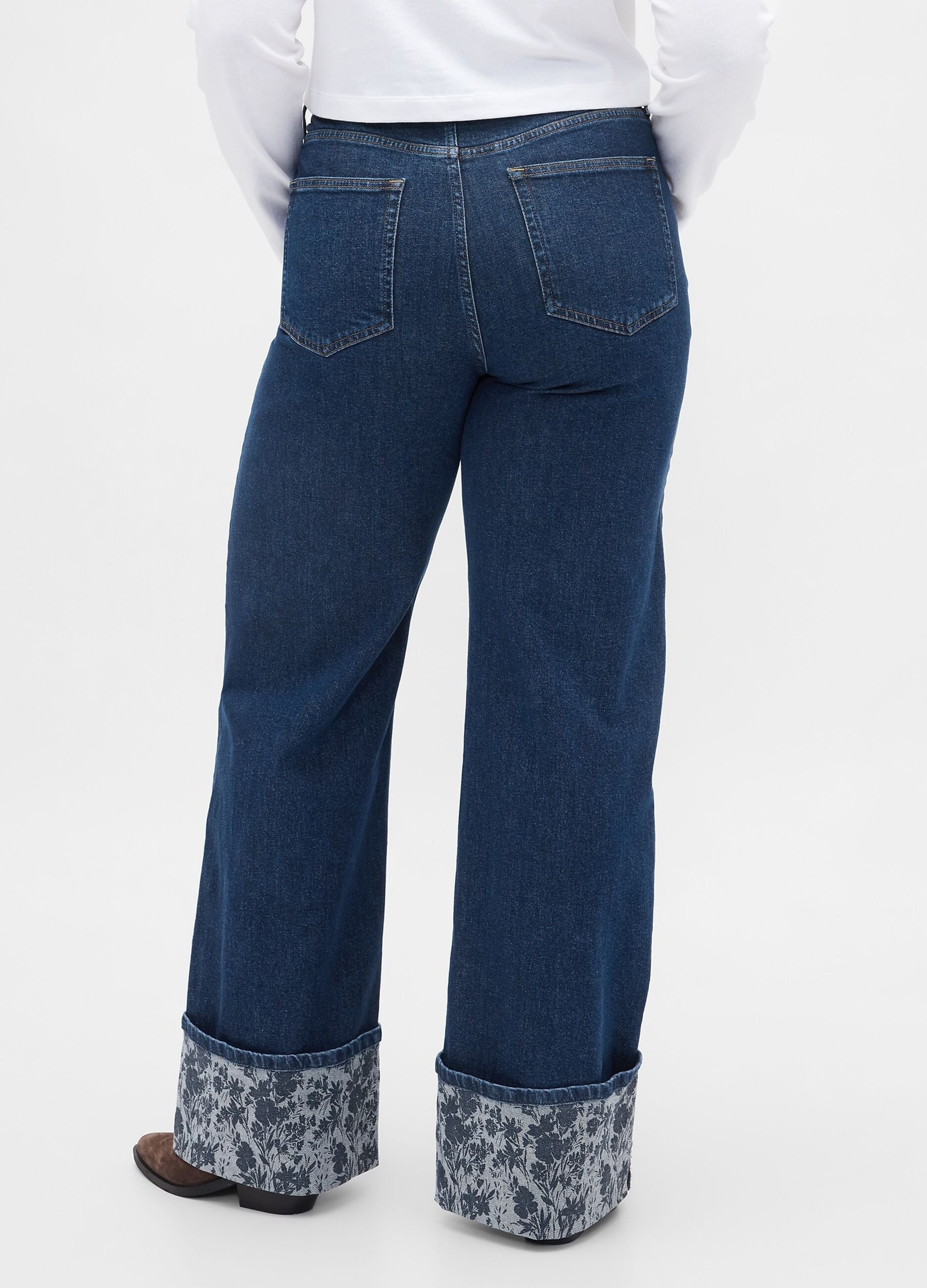 Wide denim trousers with floral turn-up