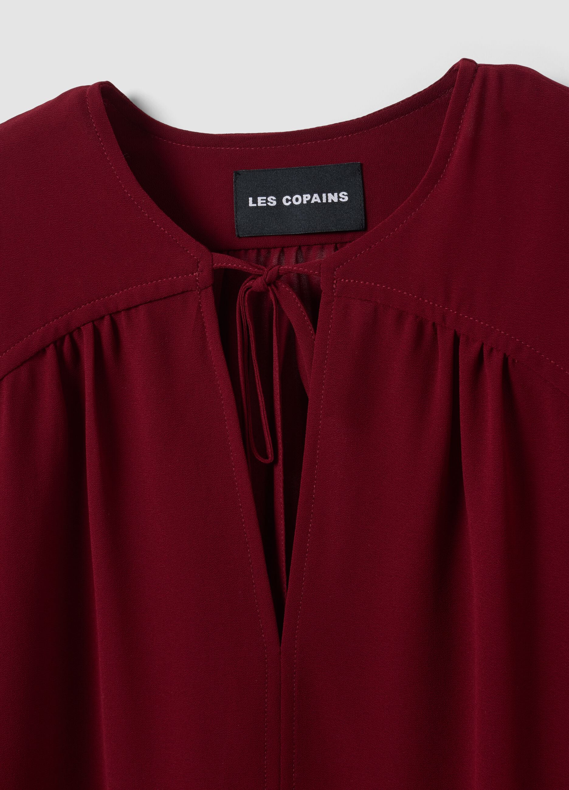 Red regular-fit blouse with V-neck and tie detail