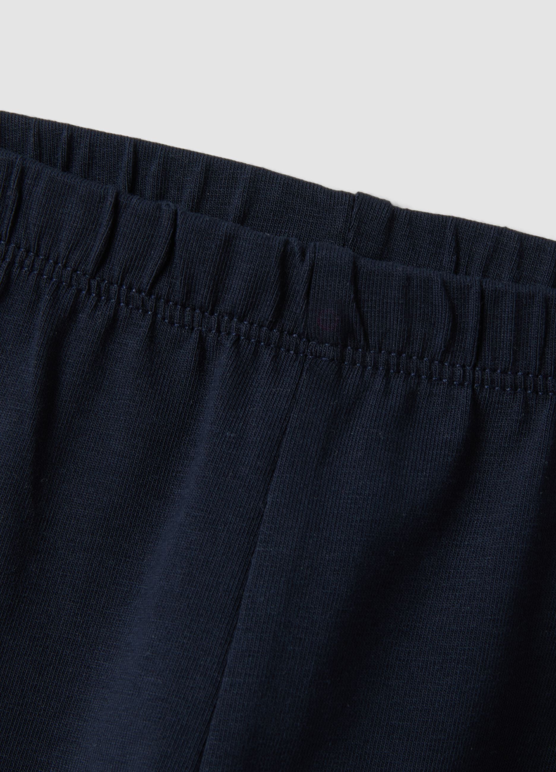 Blue stretch organic cotton leggings with bows for baby girl