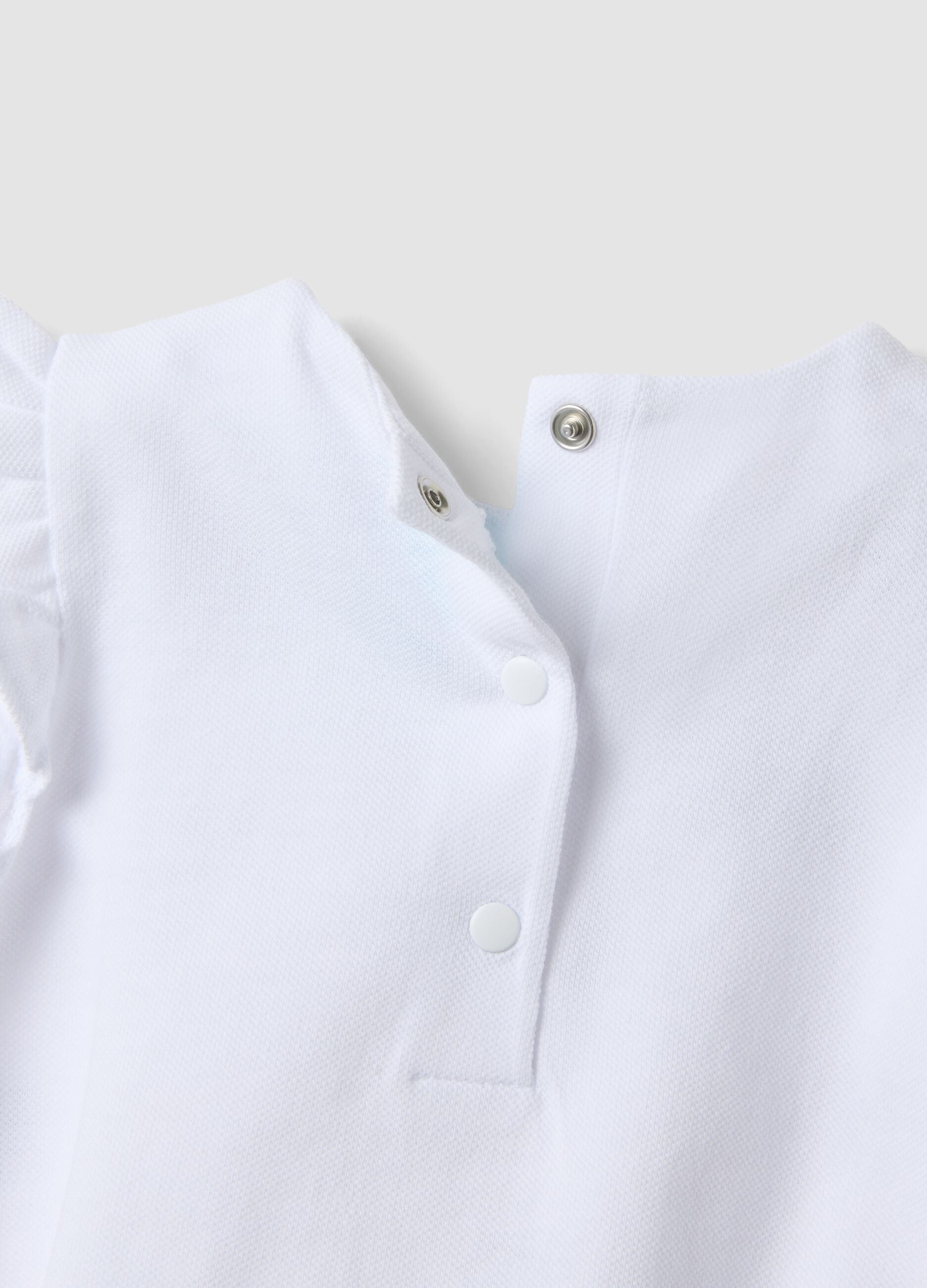 White organic cotton baby romper with ruffles