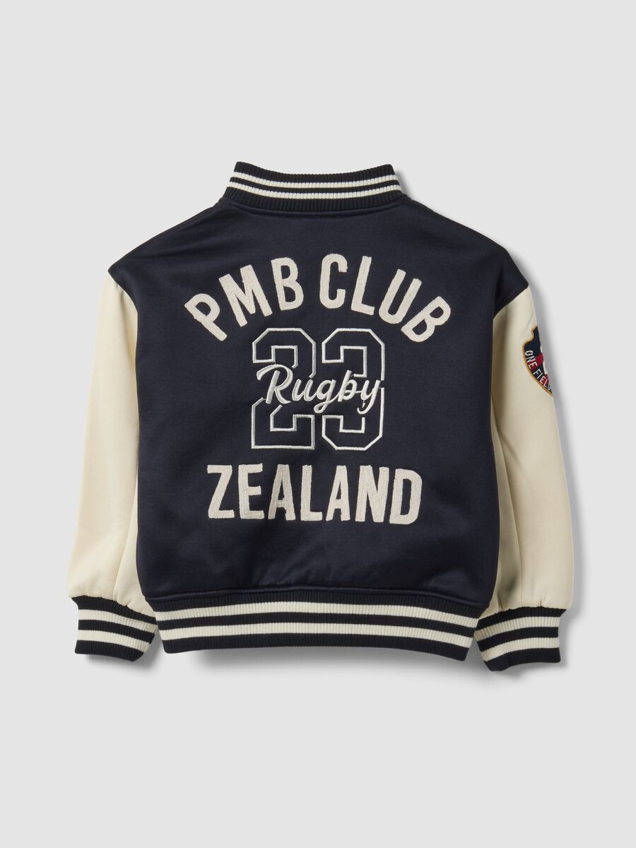 Blue varsity jacket with beige sleeves and print for boys_5
