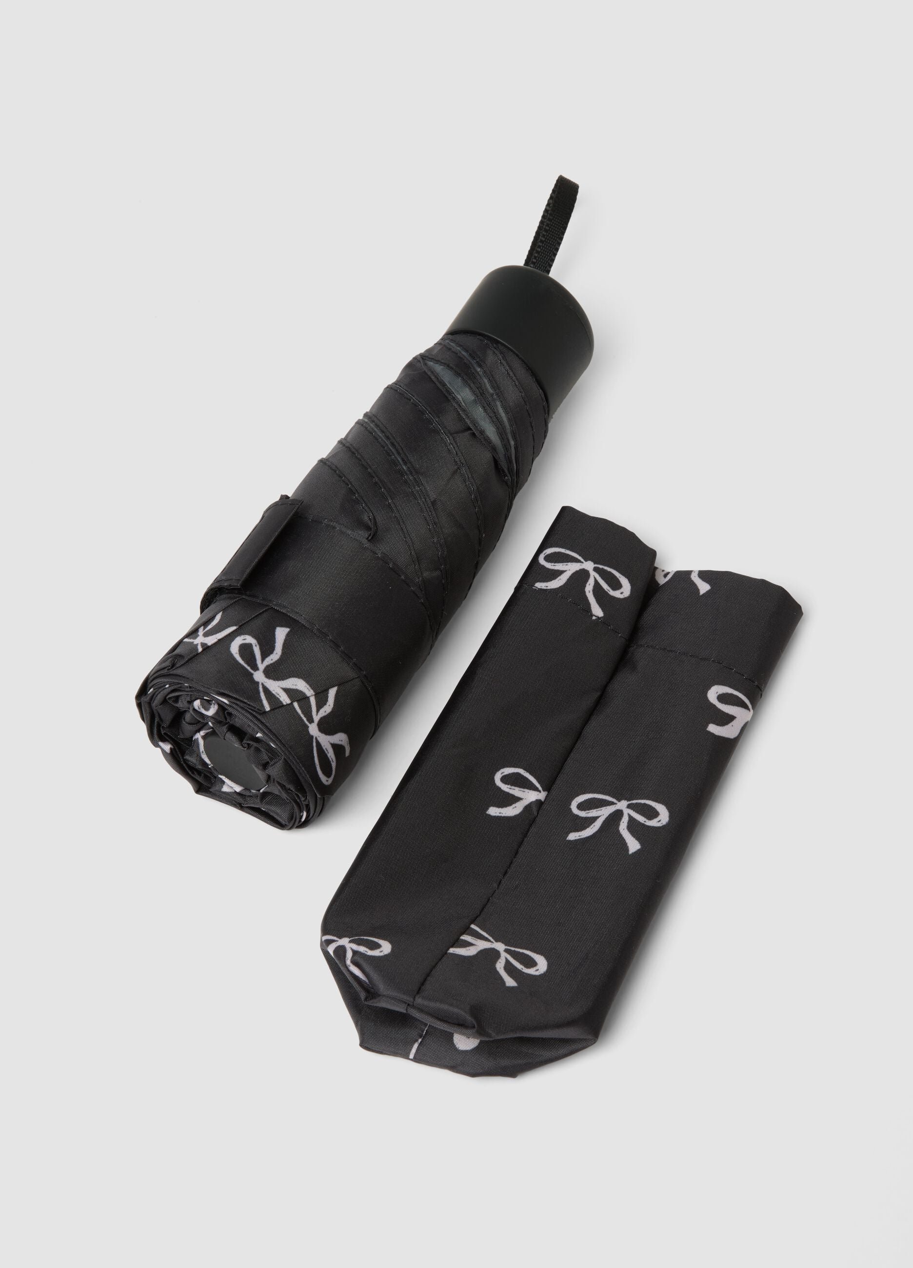 Black folding umbrella with bow print