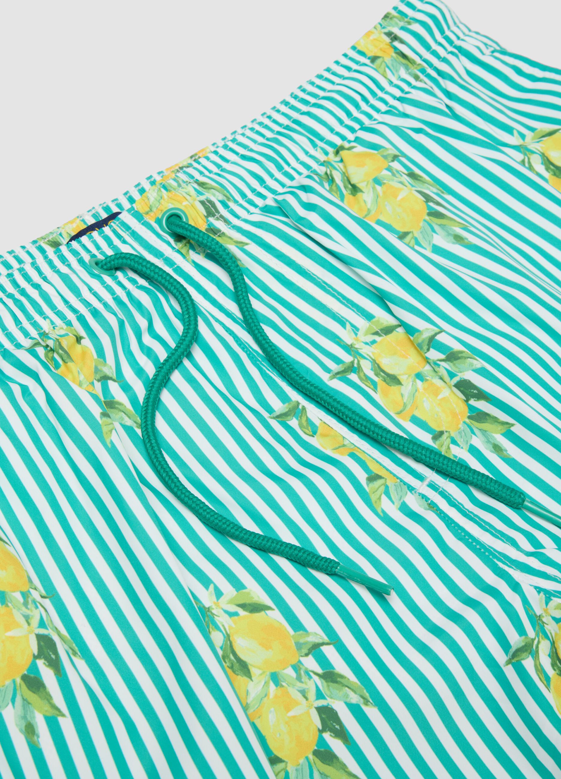 Blue striped swim shorts with lemon print