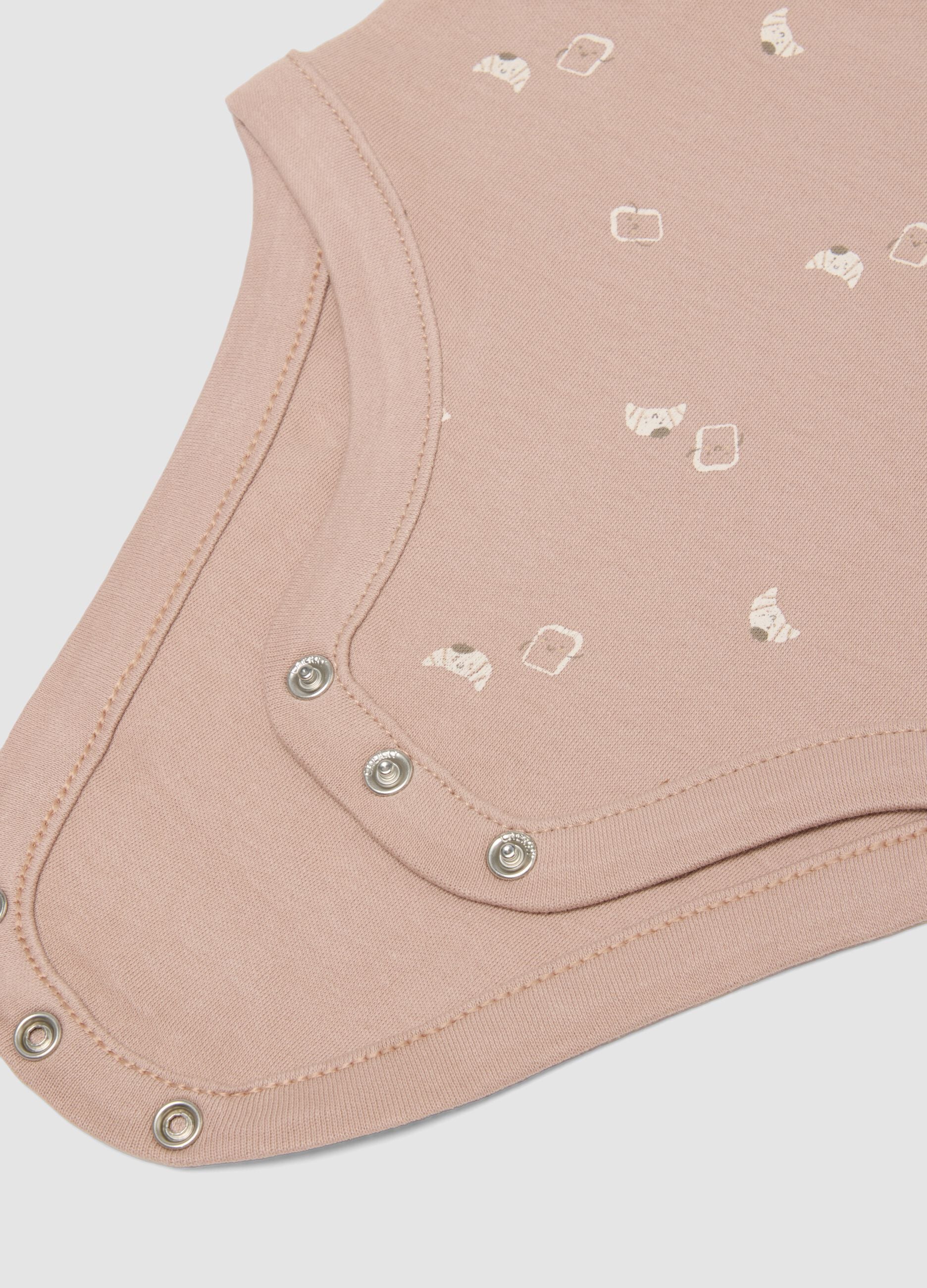 3-pack of pink and beige organic cotton short-sleeve bodysuits for babies and toddlers