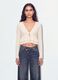 White stretch top with deep V-neck and ruffle trim_1