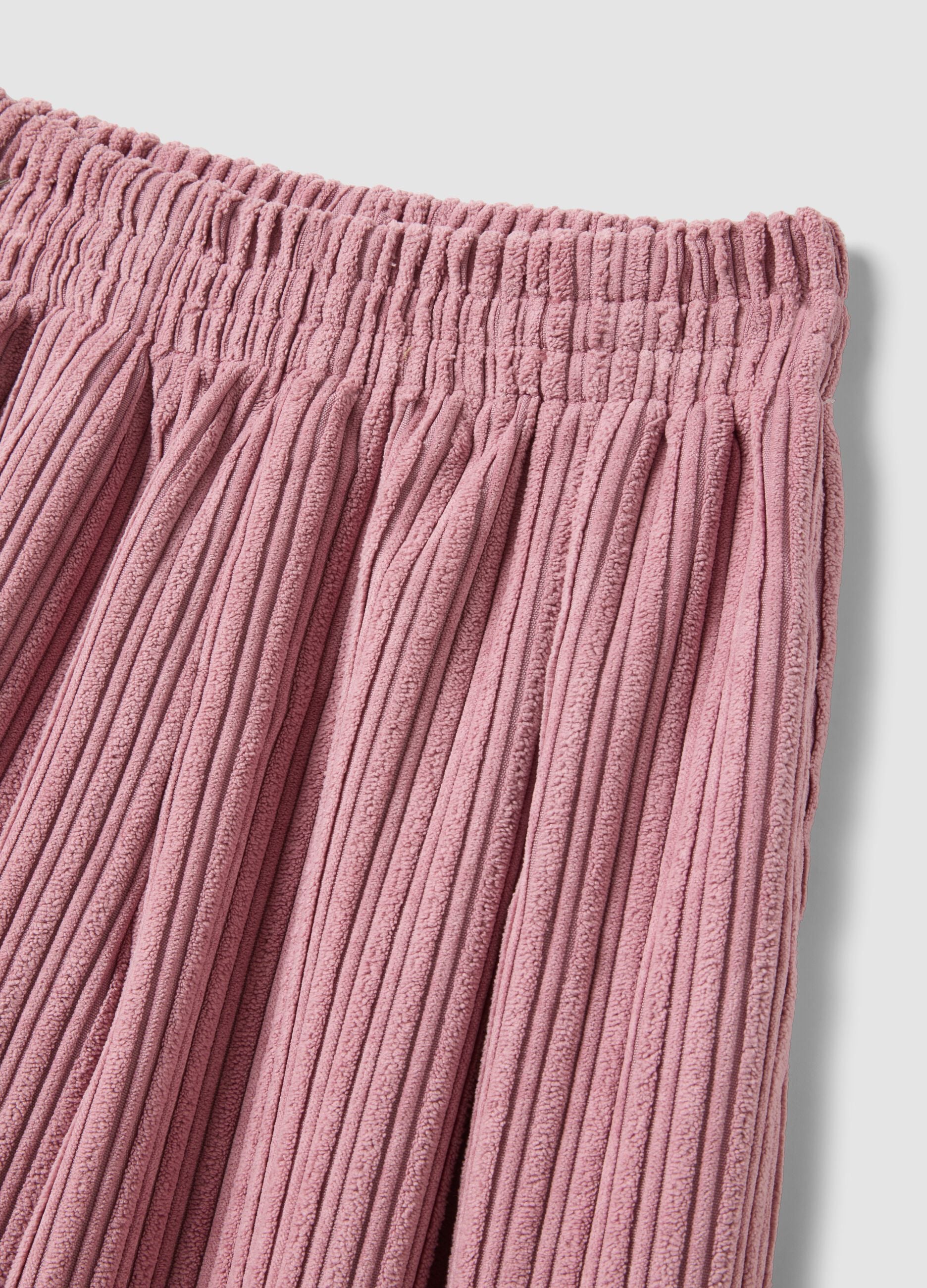 Pink wide-leg ribbed trousers with elasticated waistband