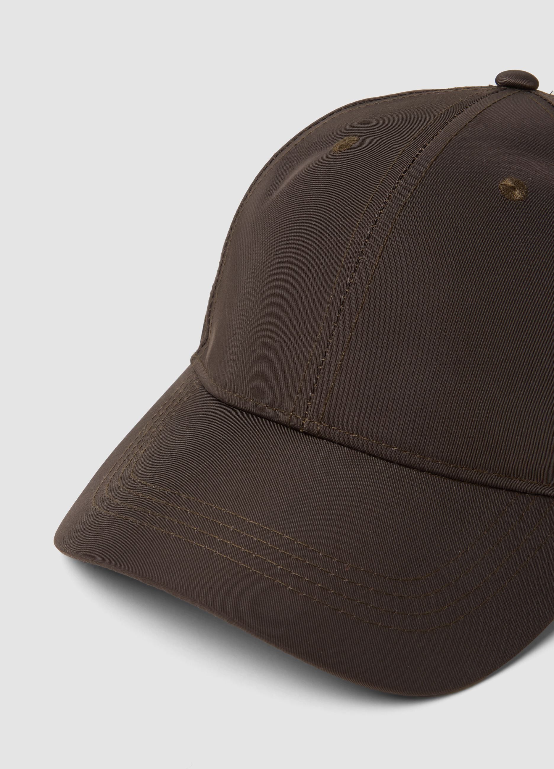 Brown cap with curved peak