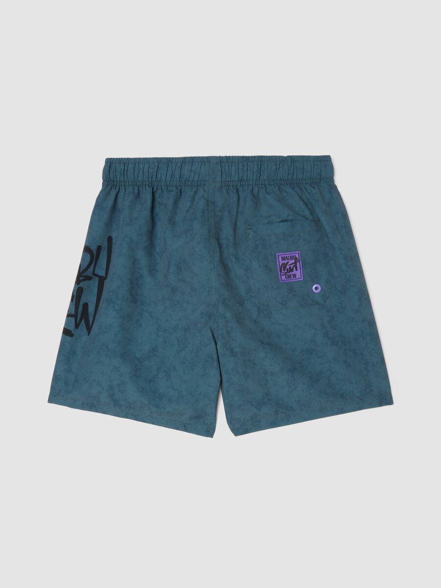Blue swim shorts with print_1