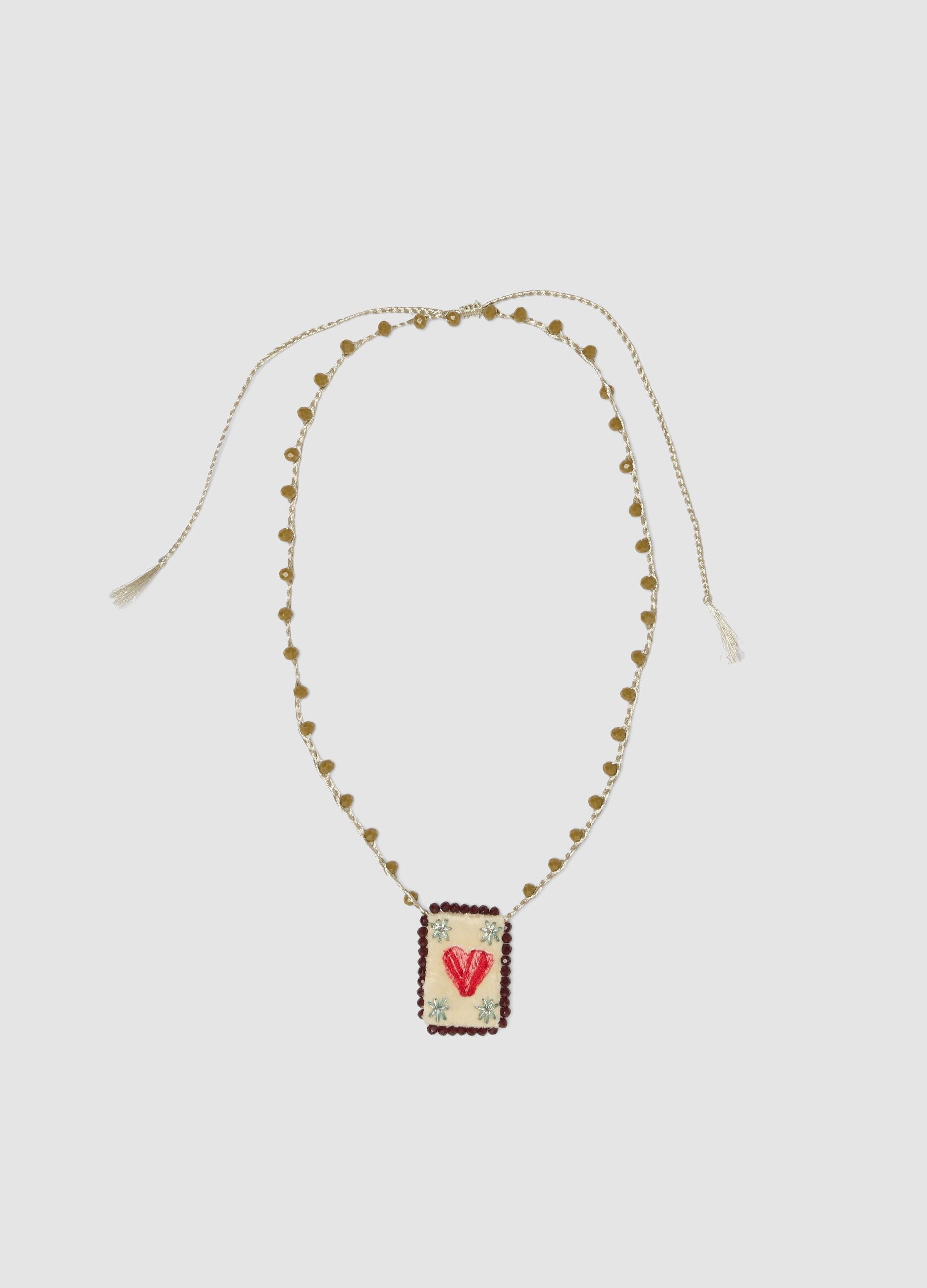Green necklace with embroidered heart pendant